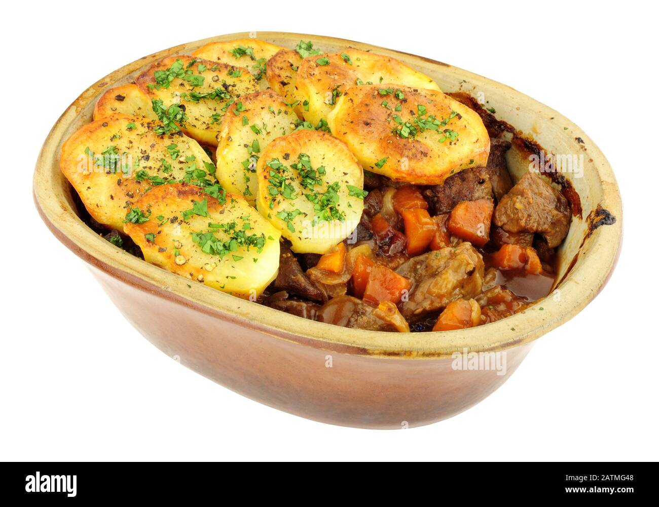 Traditional potato topped Lancashire hotpot isolated on a white background Stock Photo