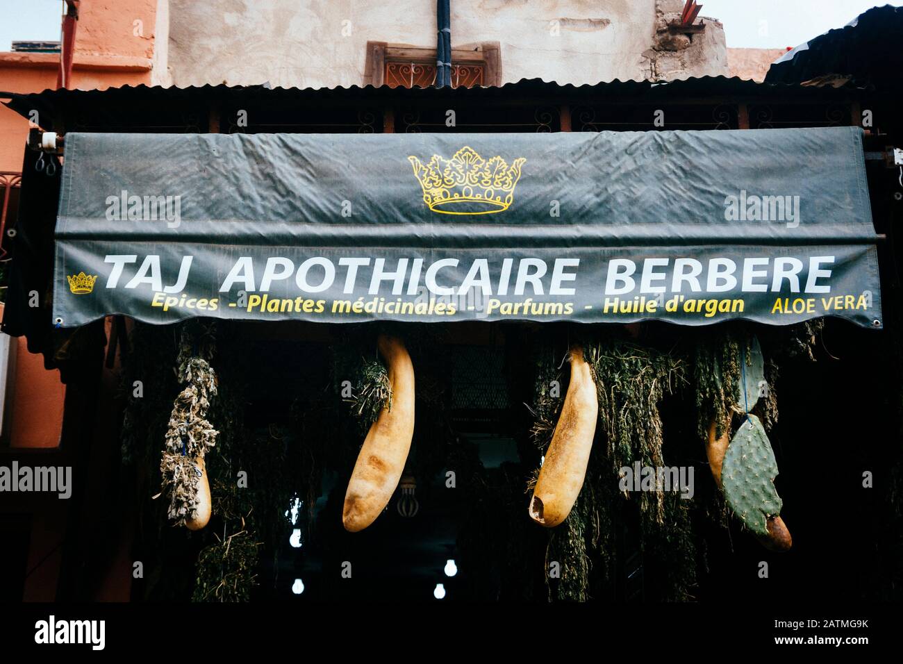 Traditional medicinal plants and herbs hang outside a pharmacy in Marrakesh, Morocco Stock Photo
