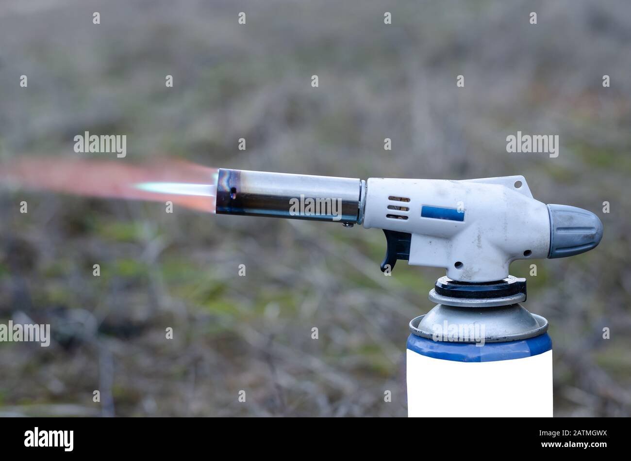 Manual gas burner. Scarlet flame from the nozzle. Ignition a gas burner