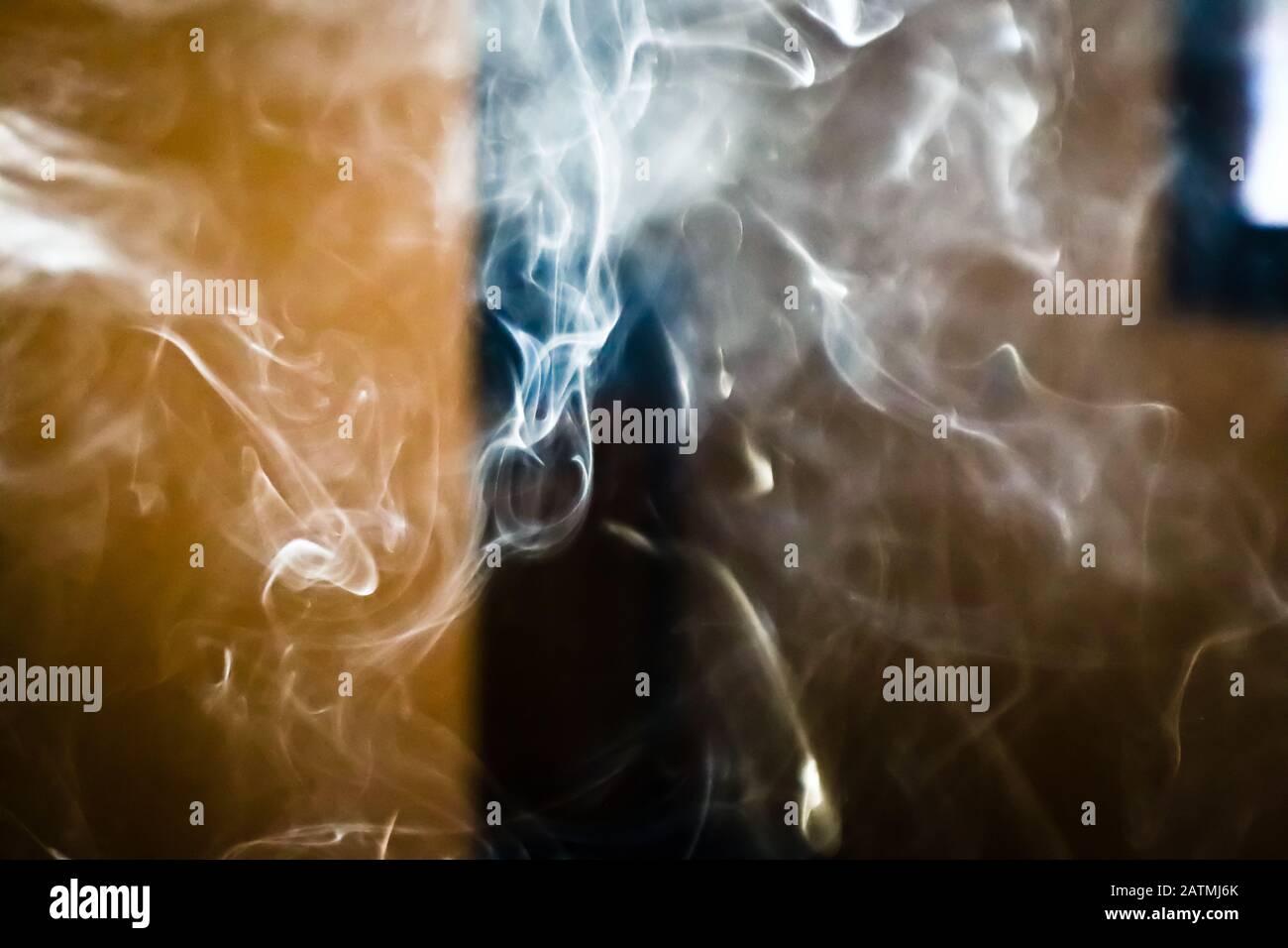 Smoke steam in room lighten by sun light, hazy steam curls for ...