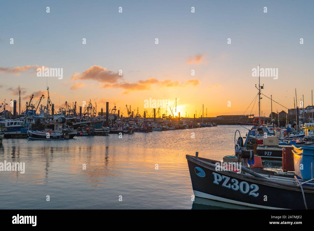 Newlyn, Cornwall, UK. 4th February 2020. UK Weather. A cold wind and clear skies brought a chilly start to the day on the seafront at Newlyn this morning. Credit Simon Maycock  / Alamy Live News. Stock Photo