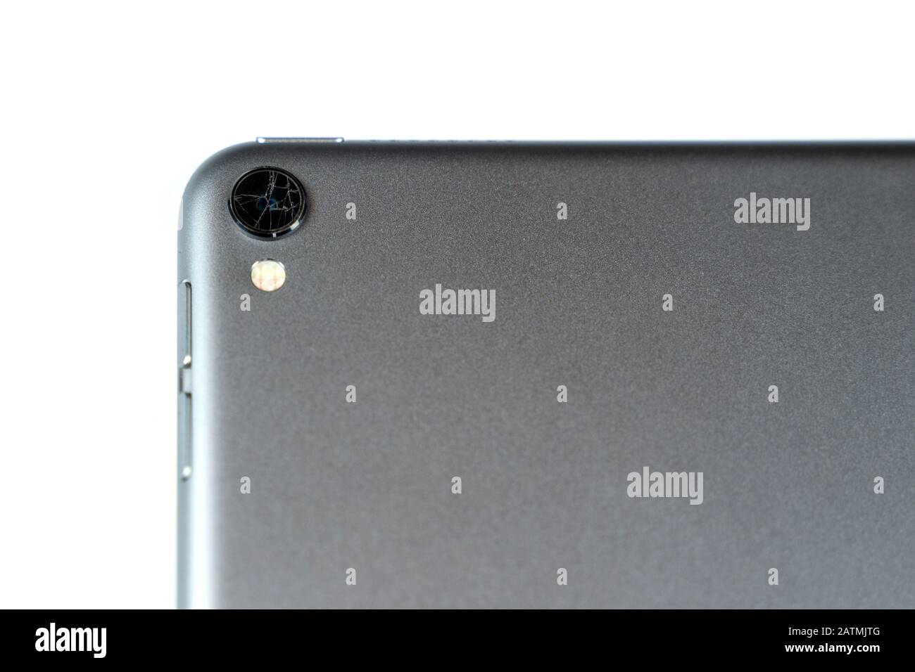 Broken lens on tablet isolated on white background Stock Photo