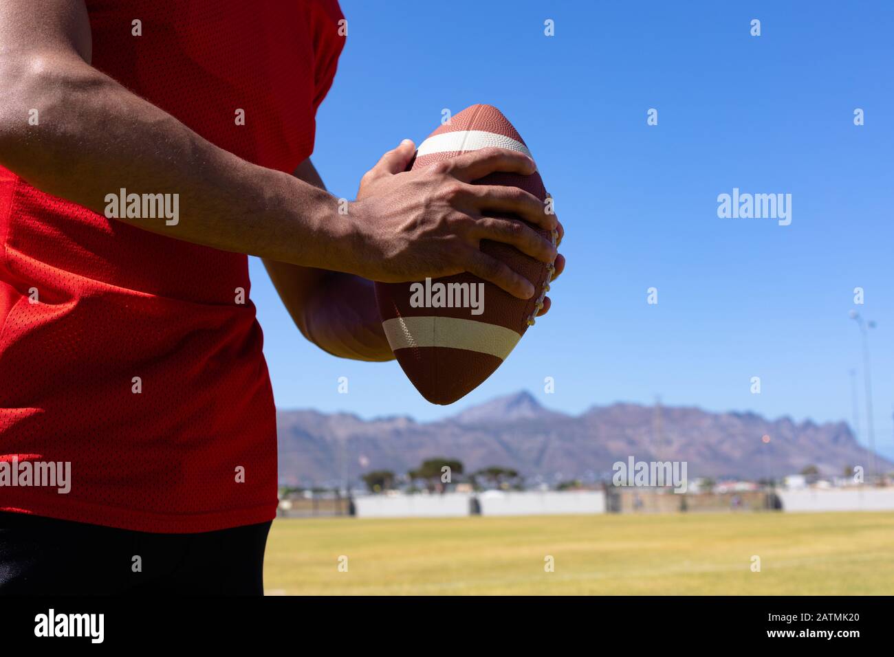 Football player with ball Stock Photo