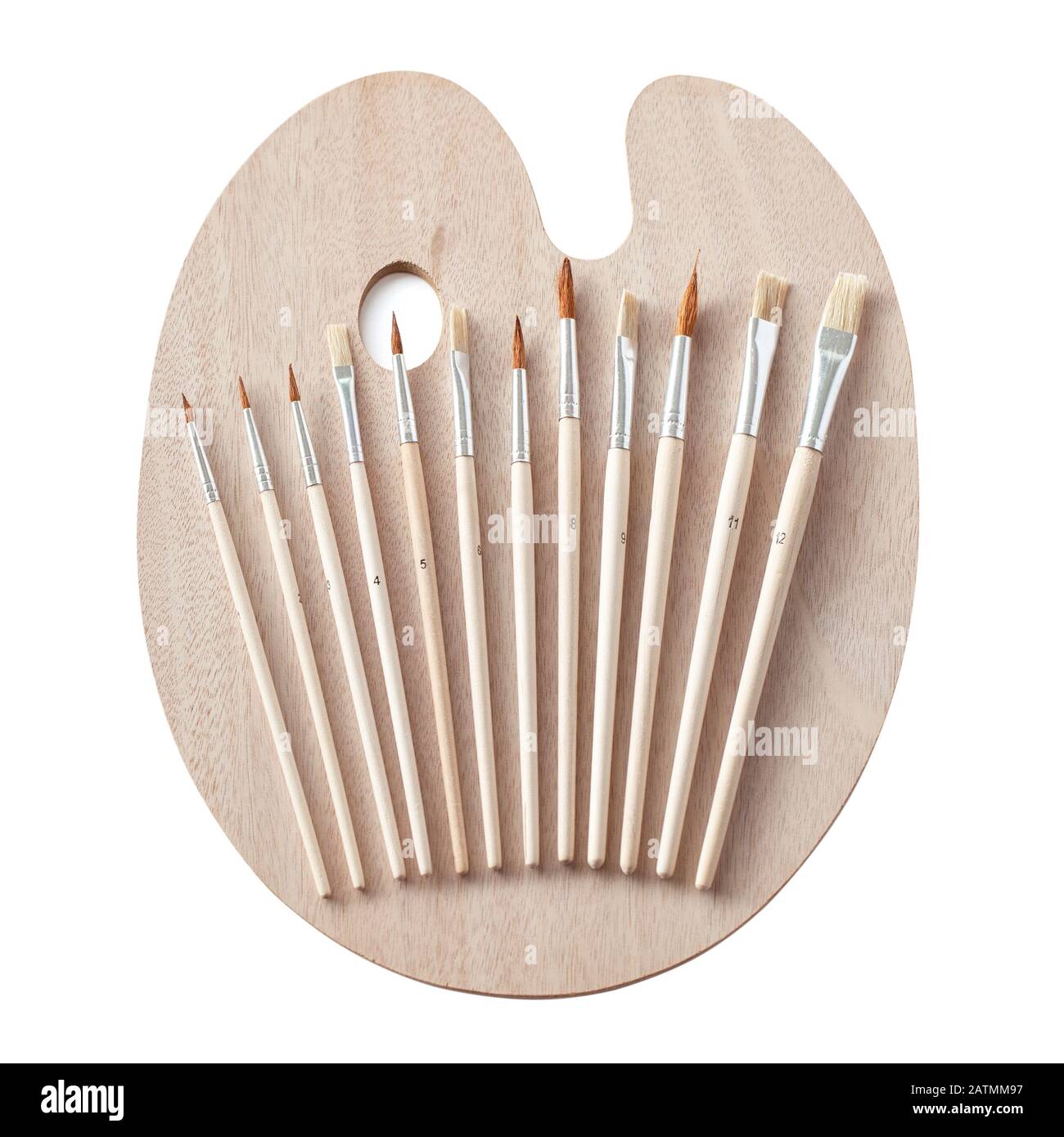 Brand new wooden painting art palette with a set of paint brushes isolated on white Stock Photo