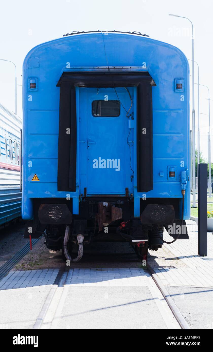 The last blue railway car of a passenger train, close up front view Stock Photo