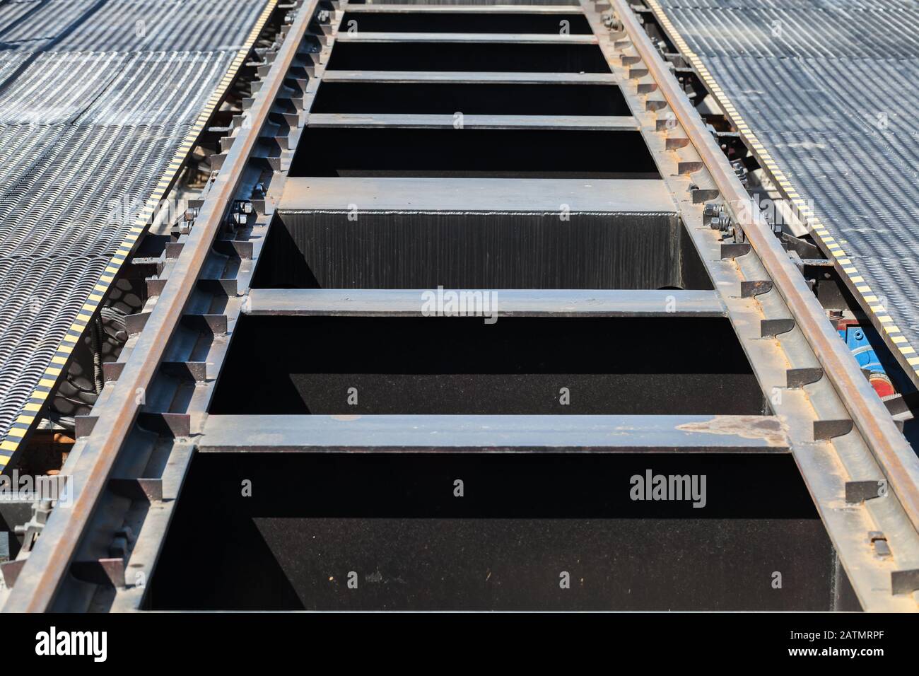 Modern steel railway track details, perspective effect Stock Photo Alamy