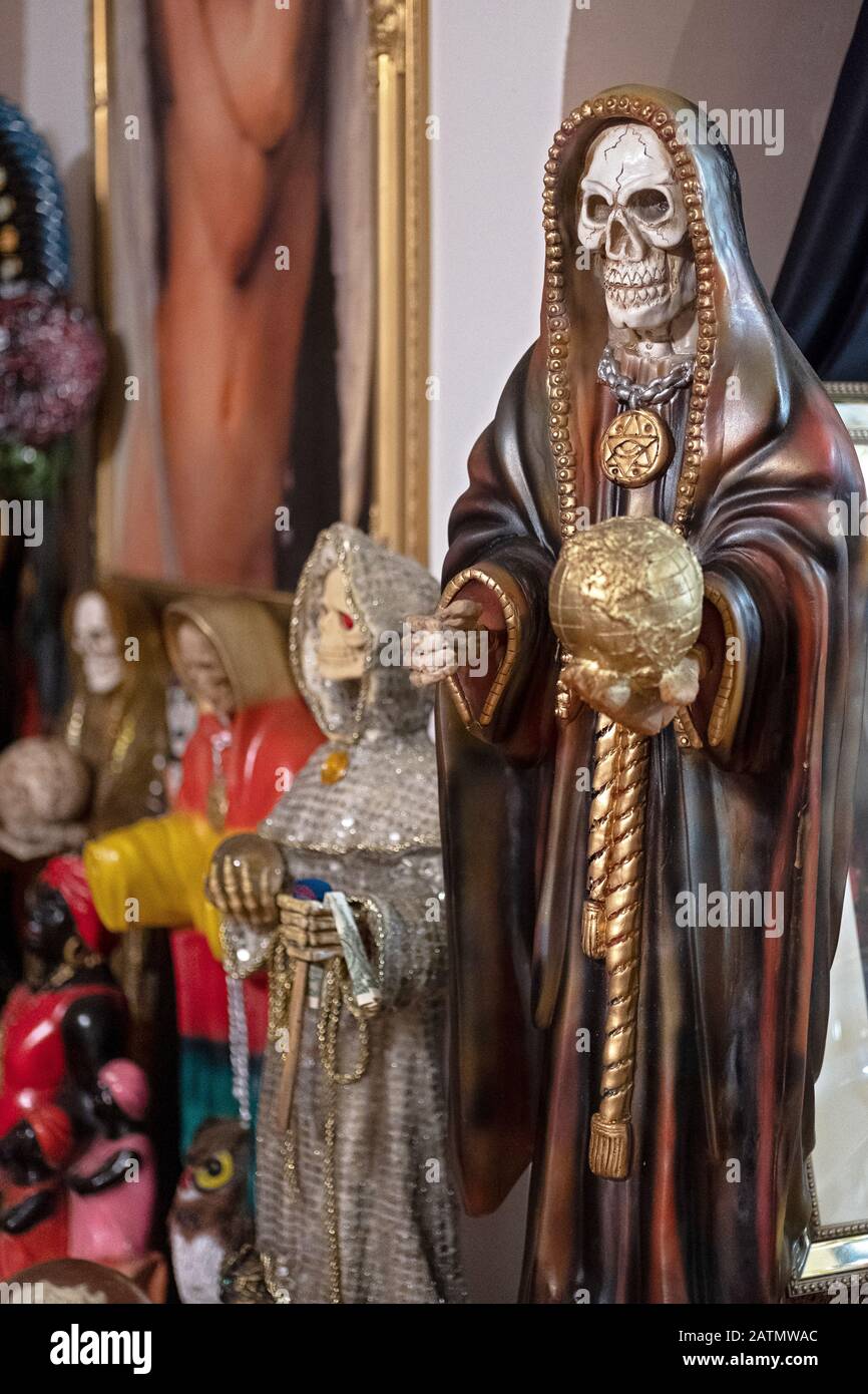 Santa Muerte statues displayed in a home temple in Jackson Heights, Queens, New York City. Stock Photo
