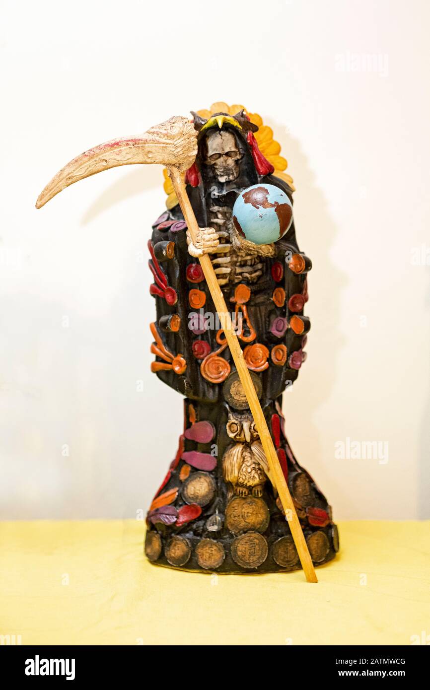 A Santa Muerte statue displayed in a home temple in Jackson Heights, Queens, New York City. Stock Photo