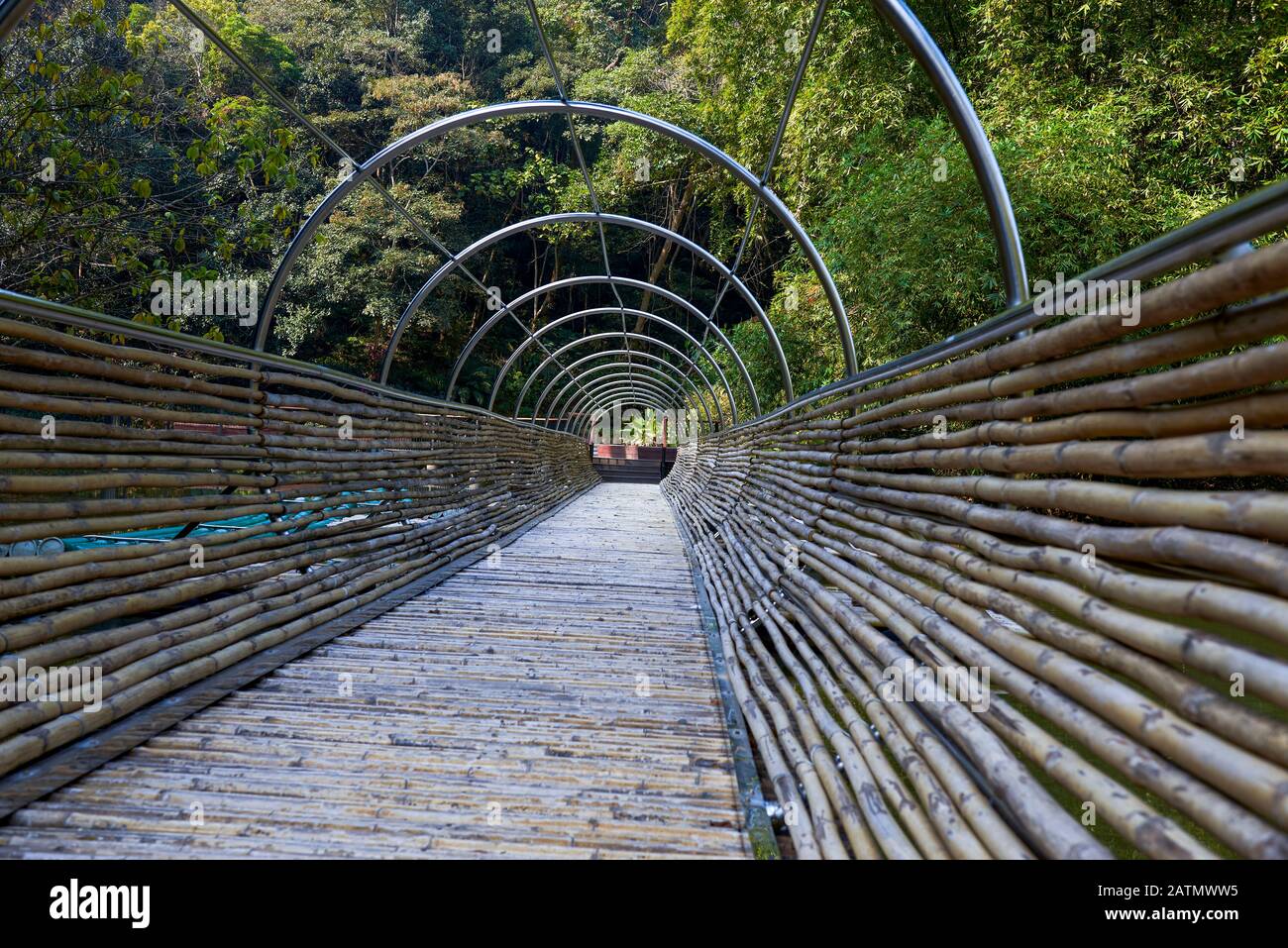 Bamboo bridge design over the river in the park Stock Photo