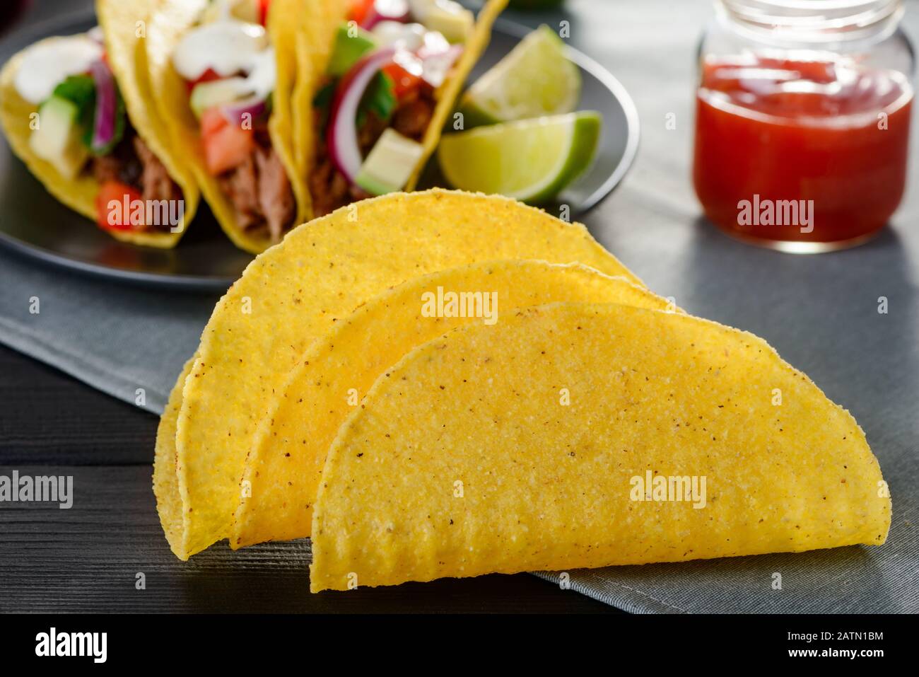 Few deep-fried corn tortillas. Cripsy base ingredient for hard-shell tacos  Stock Photo - Alamy