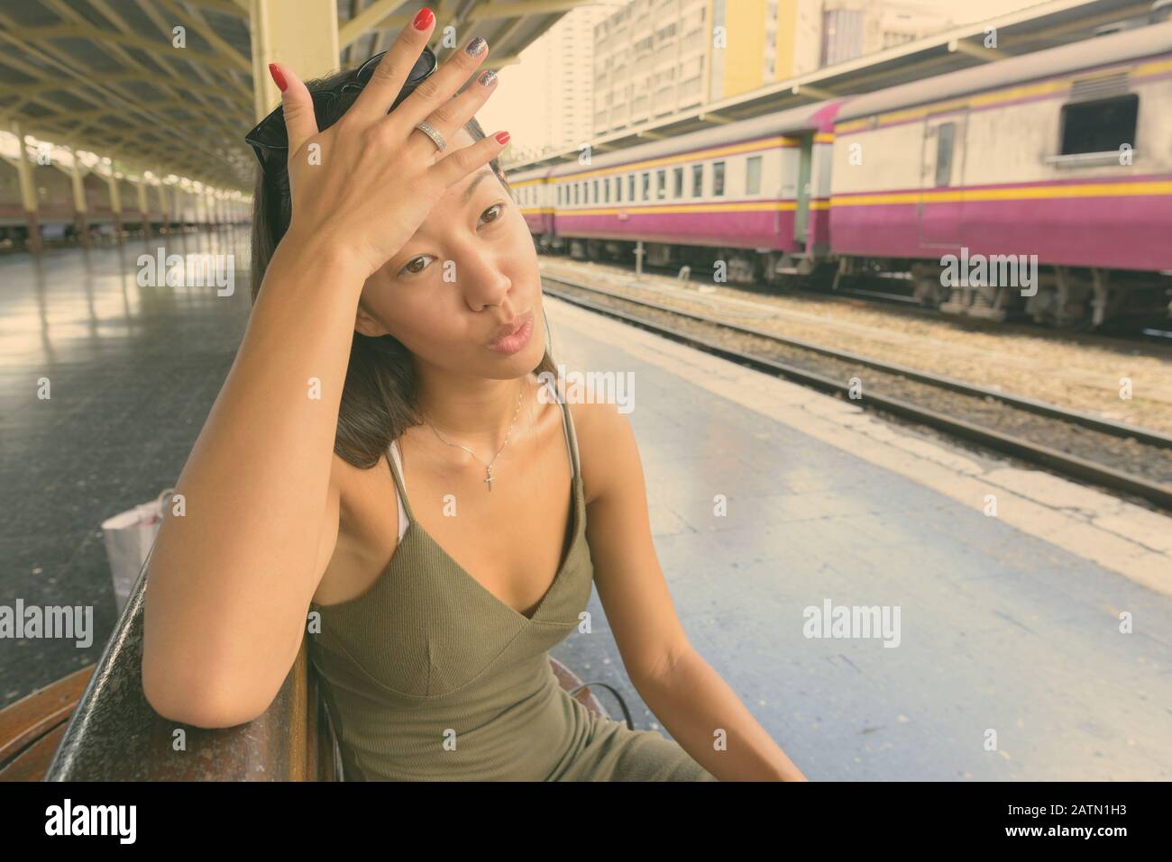 Young beautiful tourist woman exploring the city of Bangkok Stock Photo