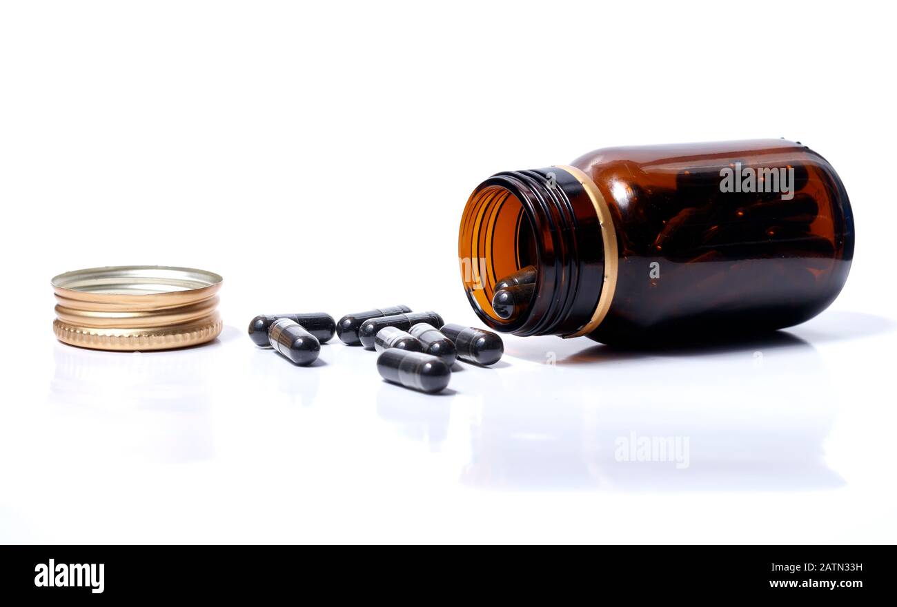 black pills in white background Stock Photo