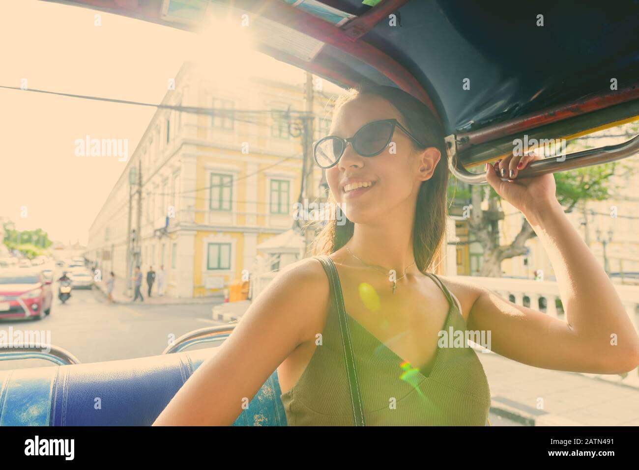 Young beautiful tourist woman exploring the city of Bangkok Stock Photo