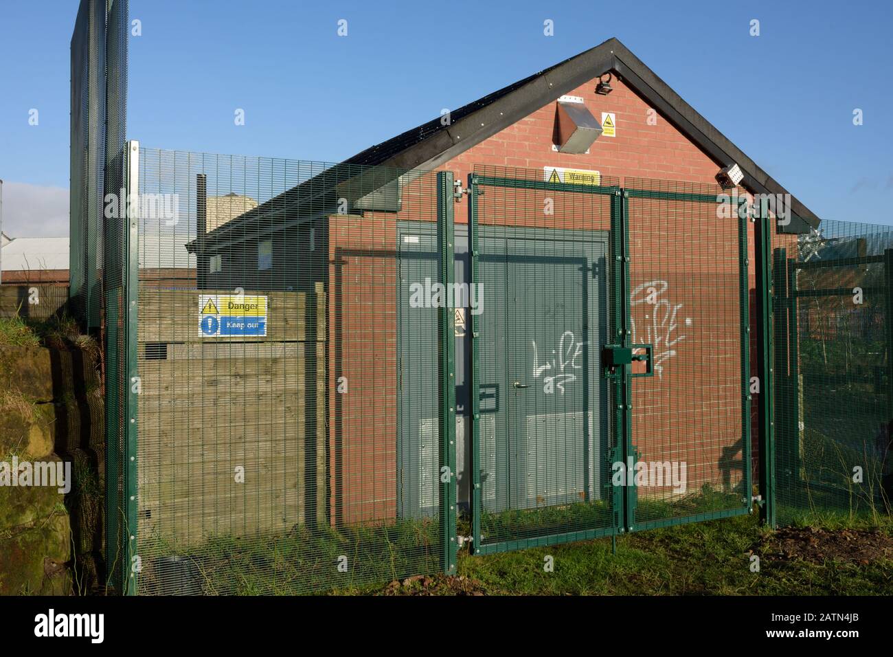 Steel security fencing protecting brick building in radcliffe bury lancashire uk Stock Photo Alamy