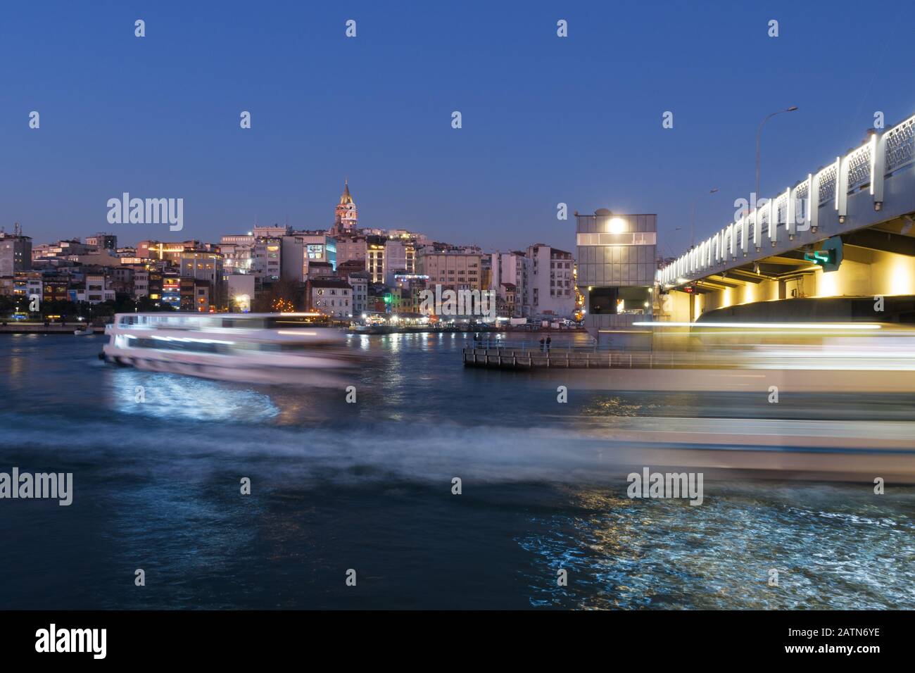Istanbul, Turkey - Jan 10, 2020: Ferry boat in Golden Horn at the Galata Bridge with Galata Tower in background, Istanbul, Turkey, Europe Stock Photo