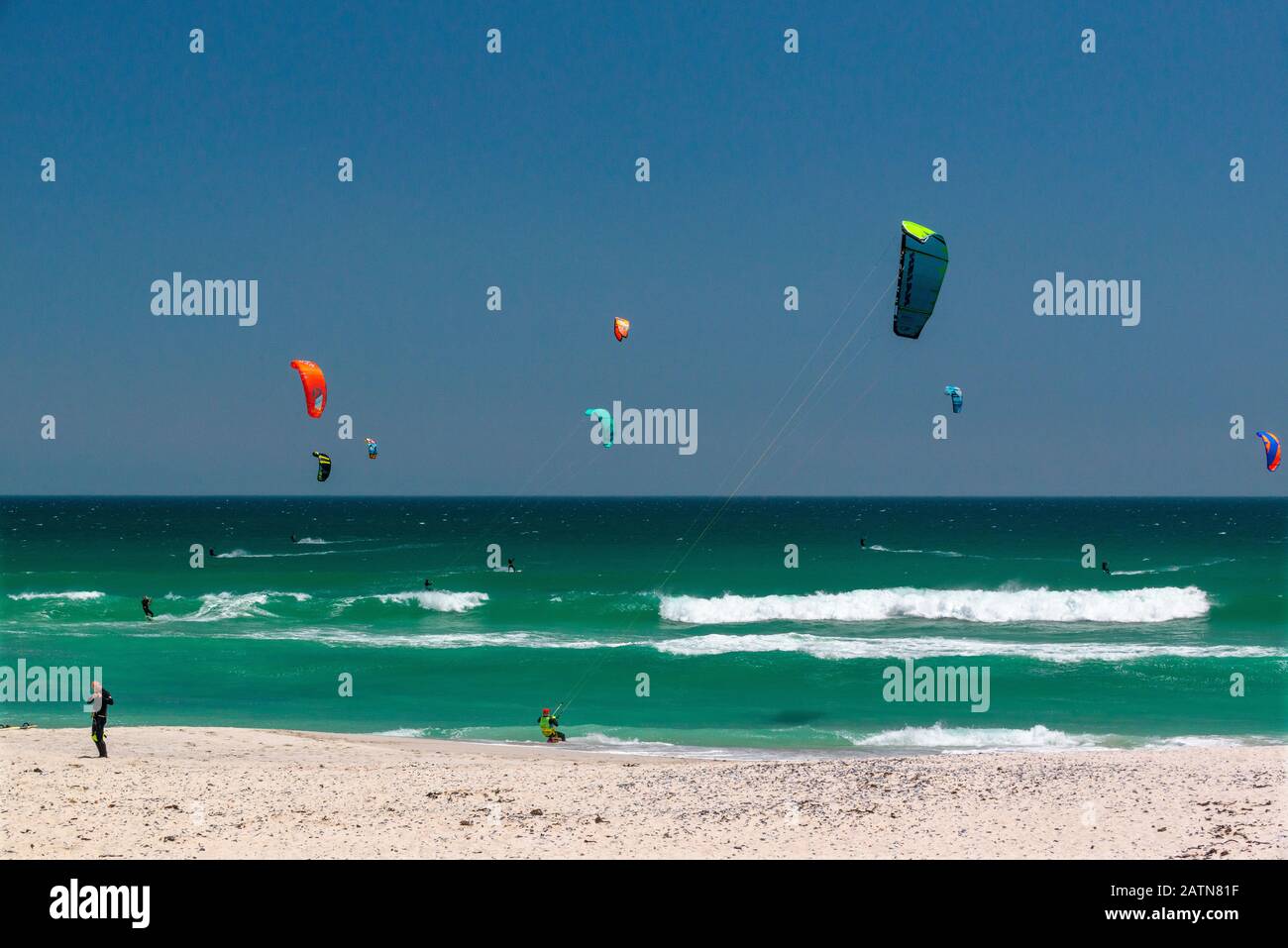 Kitesurfers enjoy their sport at the famous kiting beach at Haakgat Point, Otto du Plessis Drive, Melkbosstrand, Table Bay, Capte Town, South Africa Stock Photo