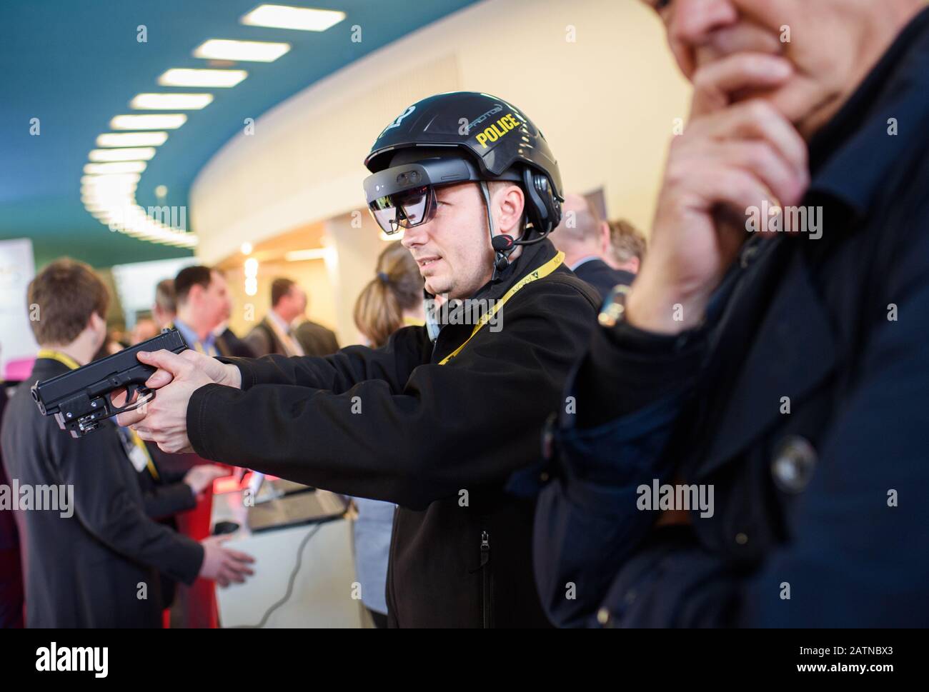 Berlin, Germany. 04th Feb, 2020. During the 25th European Police Congress, an employee of the company 'RealSim' shows a visitor the application of an augmented reality training simulation. The motto of the event is 'Europe: Enforcing the Rule of Law'. Credit: Gregor Fischer/dpa/Alamy Live News Stock Photo