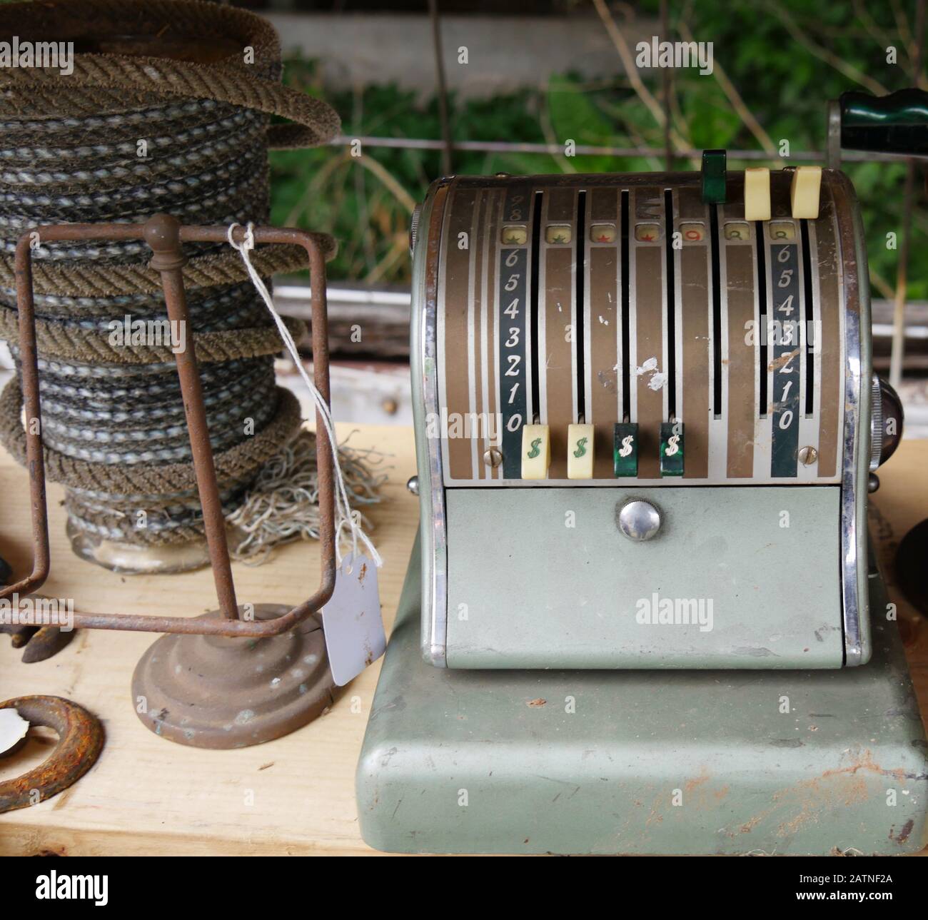 Old Rope And Rusted Machine Vintage adding machine and a roll of old ropes sold at a flea market ...