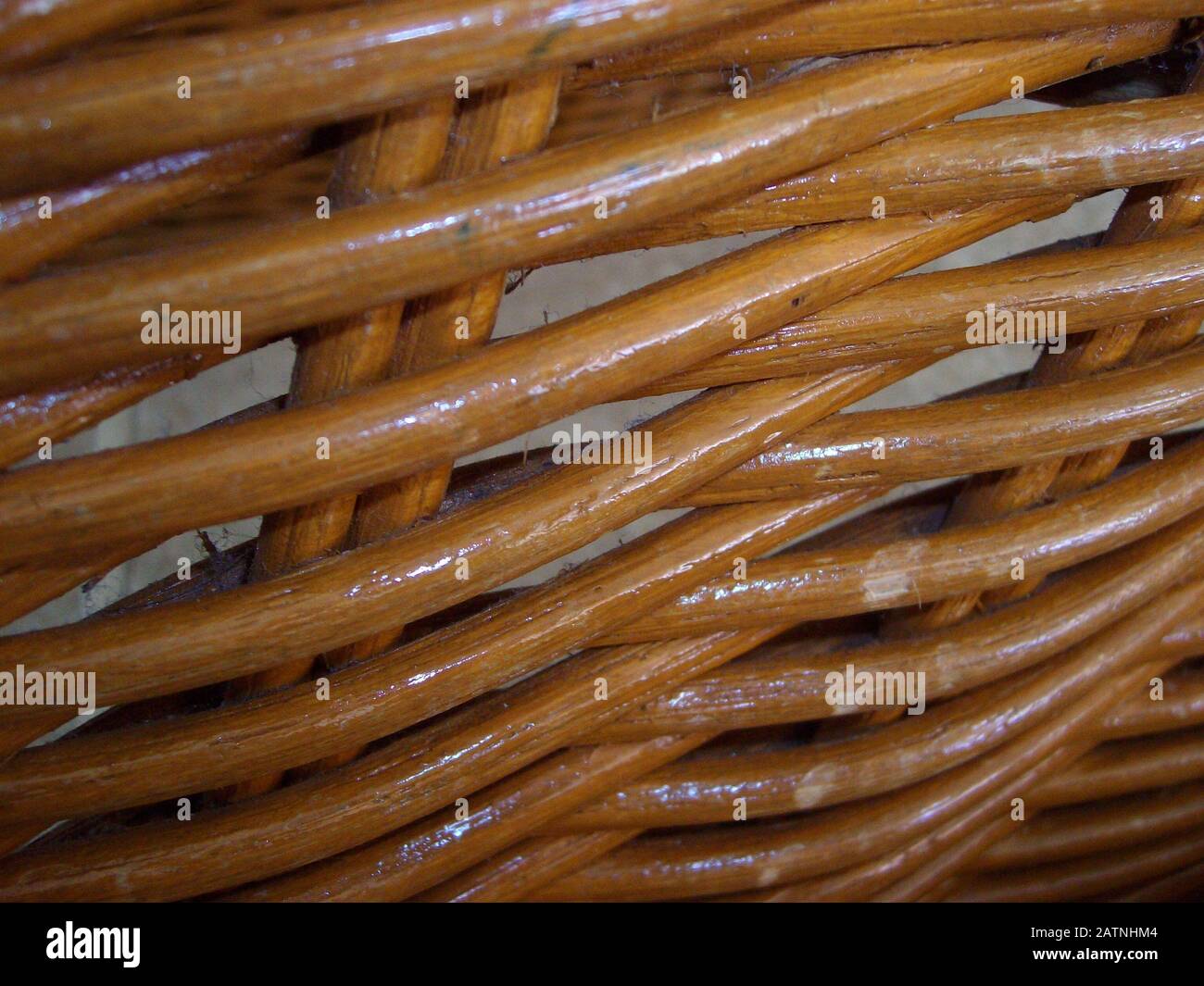 Shiny rattan strips interwoven and used for furniture backing, close up