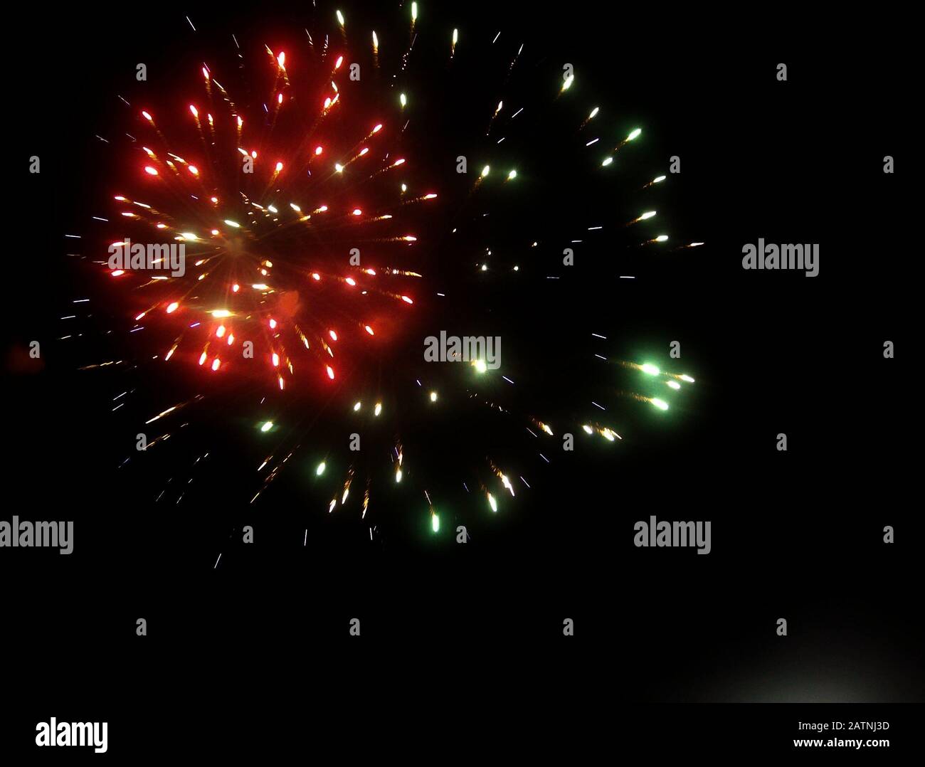 Explosion of colors from a fireworks in the skies Stock Photo - Alamy