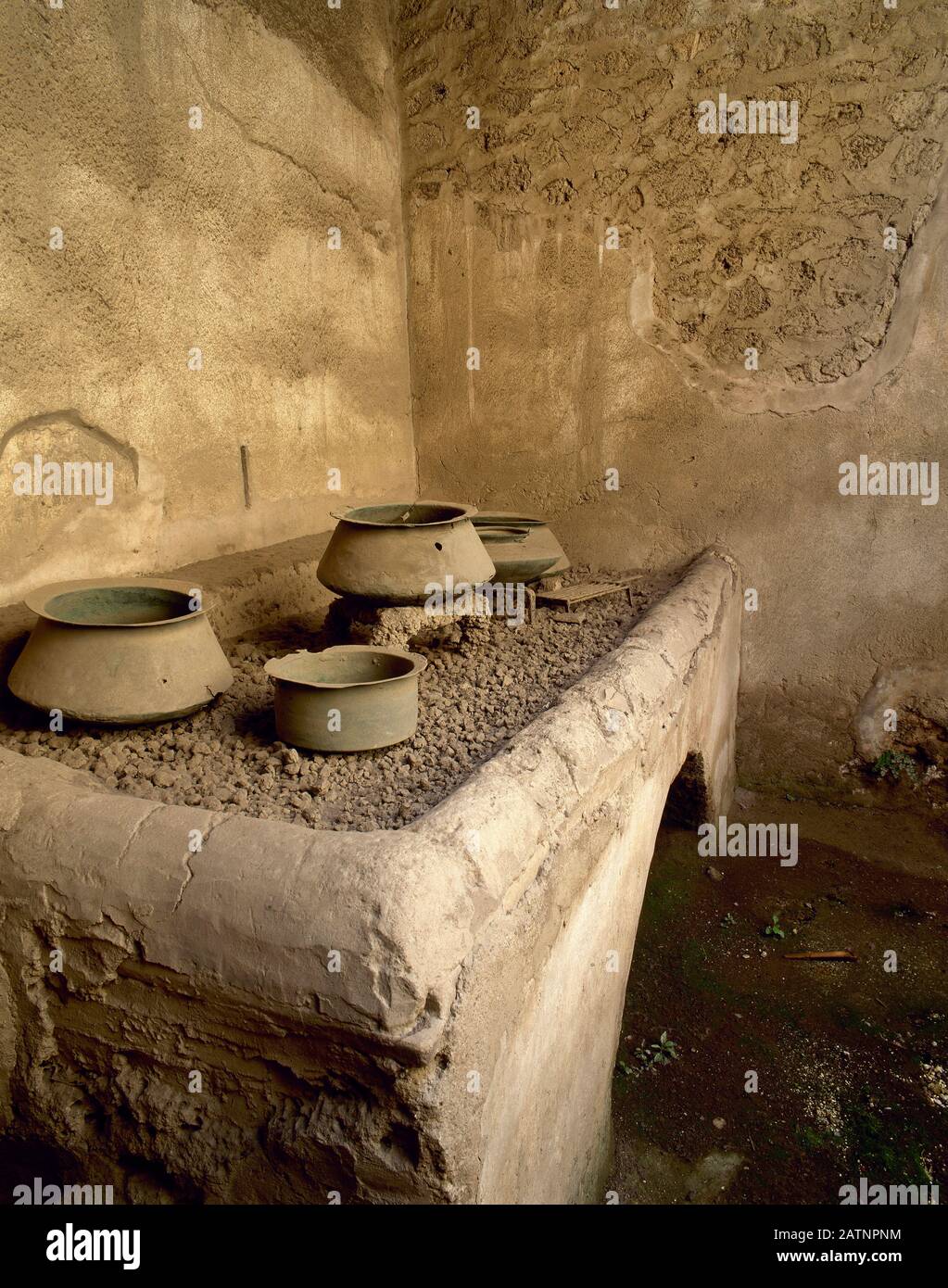 Italy, Pompeii. House of the Vetti, 1st century AD. Domus belonging to two rich merchants, Vettio Restitulo and Aulo Vettio Convivo. Kitchen with pots. Stock Photo
