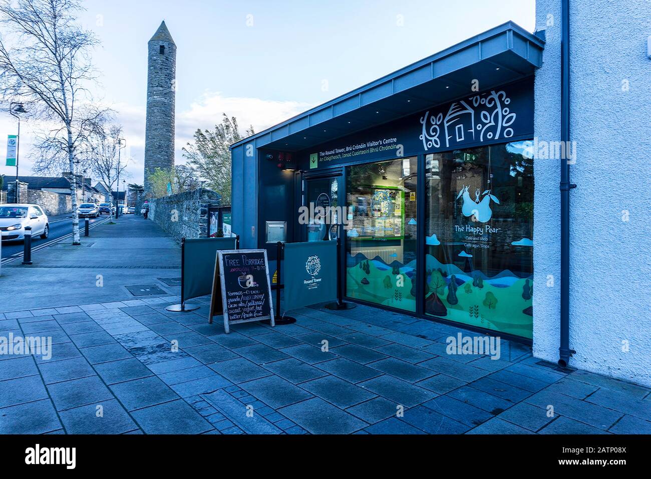 The Happy Pear Vegetarian Restaurant in Clondalkin (now closed), Dublin,  with the 1000 year old Round Tower in the background. Stock Photo