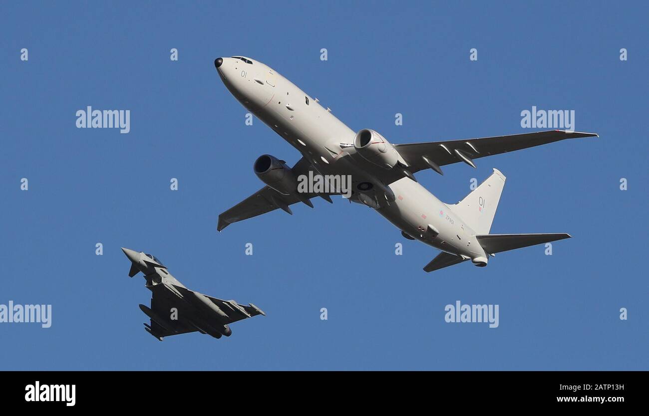 Escorted by an RAF Eurofighter Typhoon, the UK's first submarine