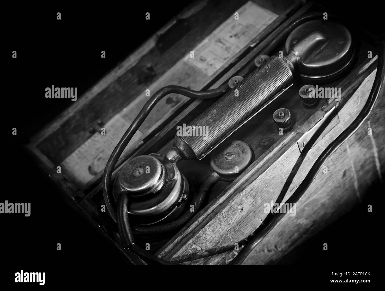 Vintage weathered military telephone from WWII period. Black and white photo Stock Photo