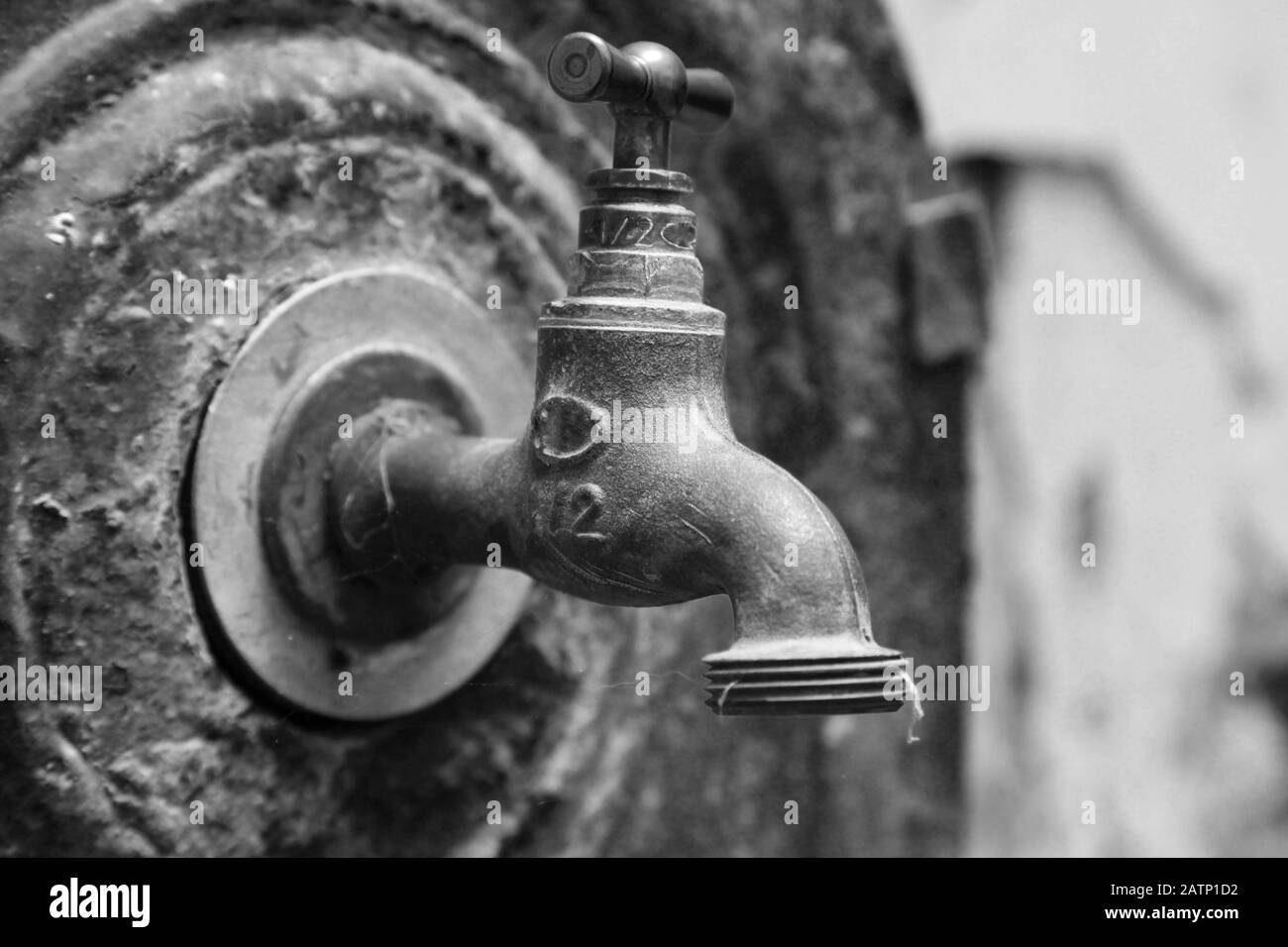 Closeup photo of old outdoor water valve. Black and white Stock Photo
