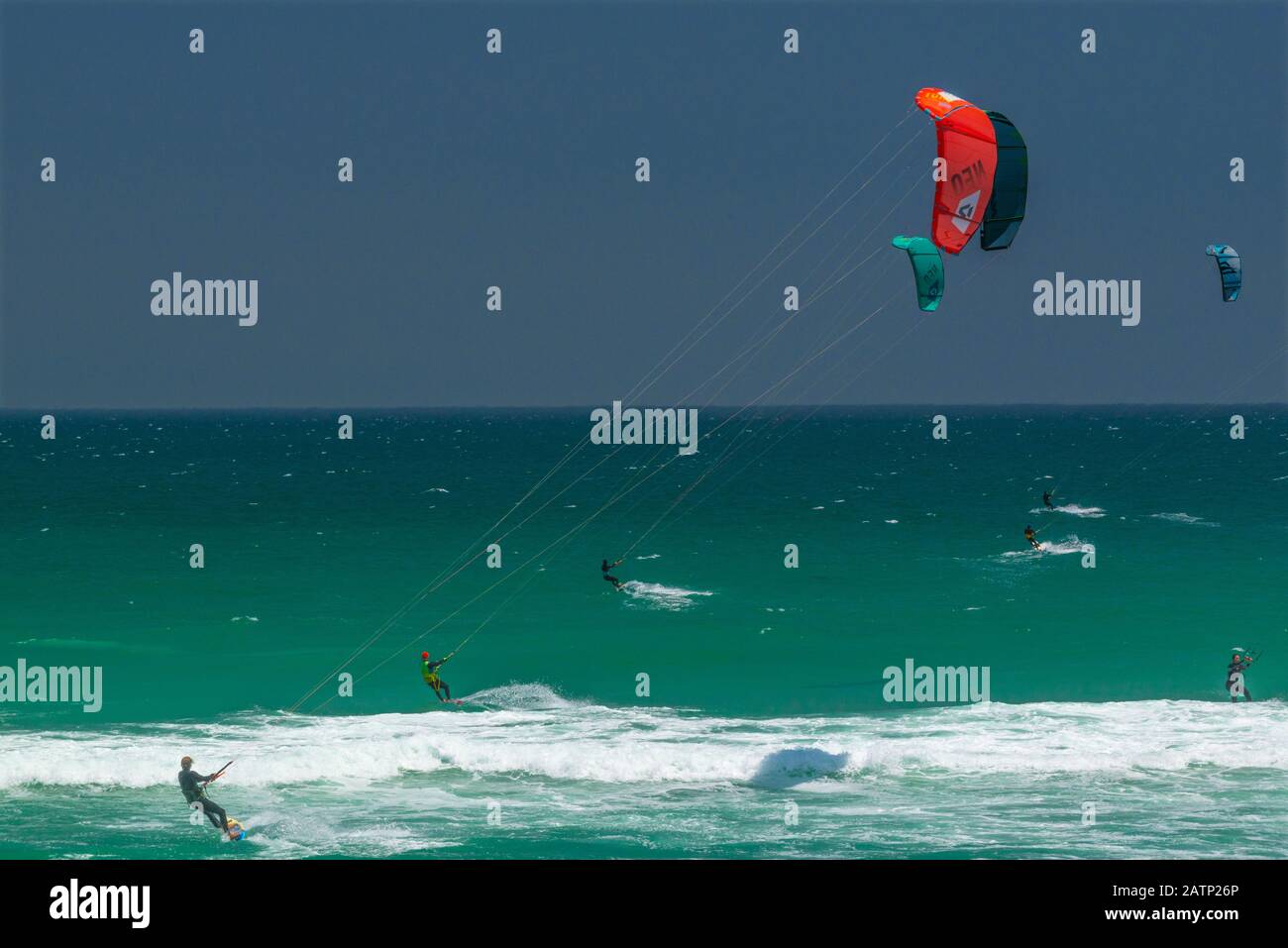 Kitesurfers enjoy their sport at the famous kiting beach at Haakgat Point, Otto du Plessis Drive, Melkbosstrand, Table Bay, Capte Town, South Africa Stock Photo