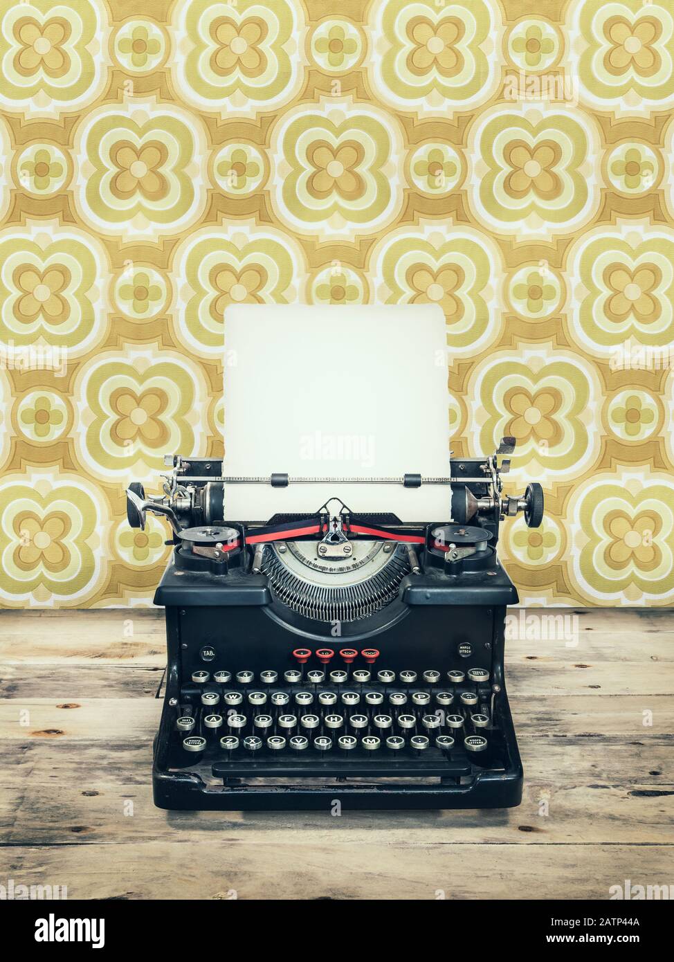 Retro styled image of an old typewriter on a wooden floor with ...