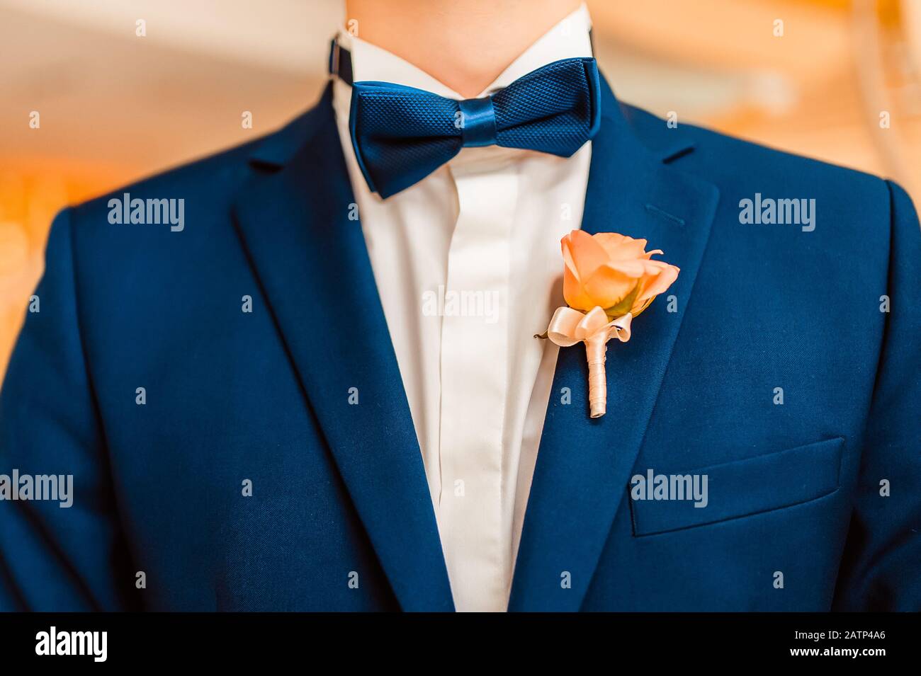 Wedding bouquet a boutonniere on a suit of the groom. Bow tie and ...
