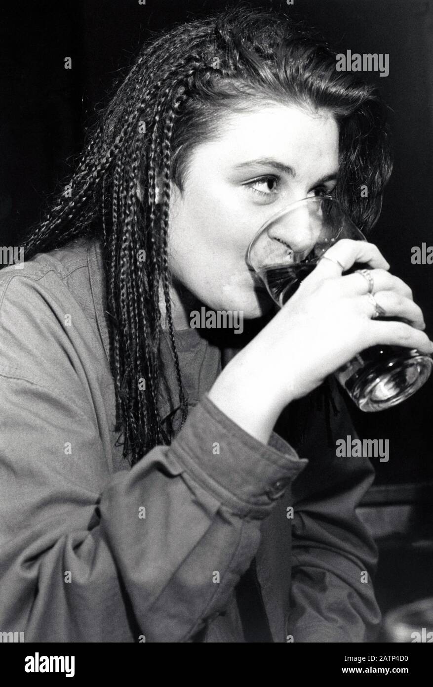 Young woman drinking Nottingham UK 1989 Stock Photo