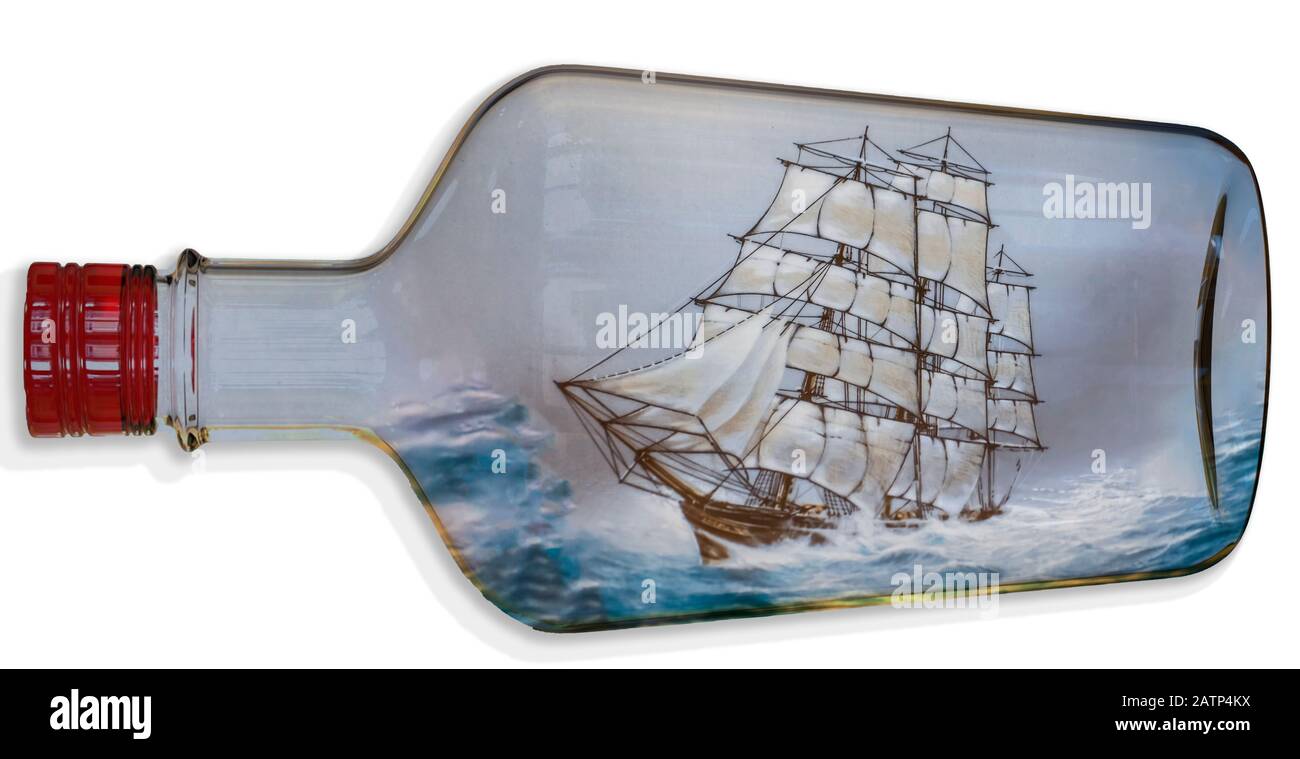Digitally created image of a tall ship with full sail sailing in a rough sea inside a transparent bottle Stock Photo