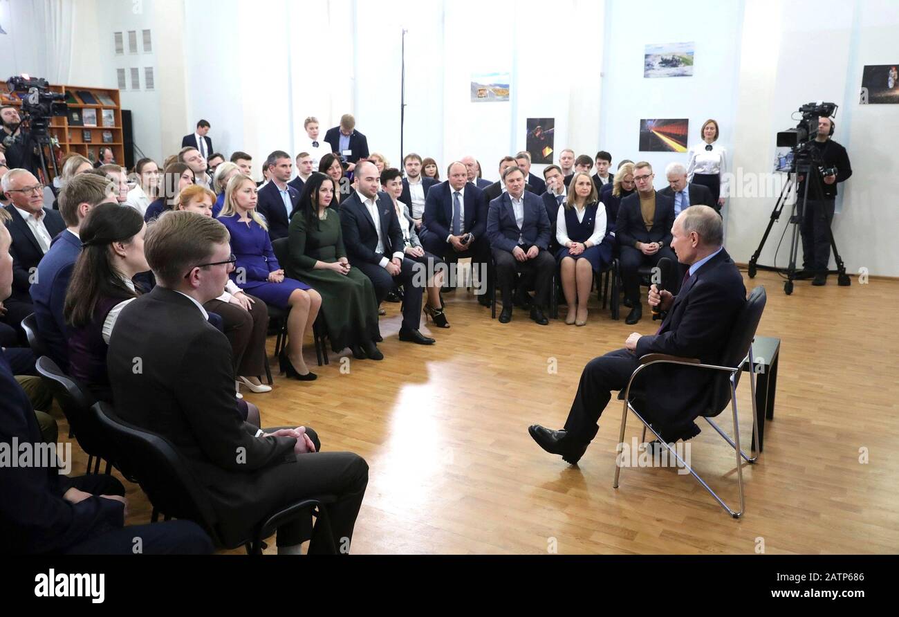 Cherepovets, Russia. 04 February, 2020. Russian President Vladimir Putin, right, hosts a meeting with members of the public during a visit to the Vologda Region February 4, 2020 in Cherepovets, Russia.   Credit: Evgeny Biyatov/Kremlin Pool/Alamy Live News Stock Photo