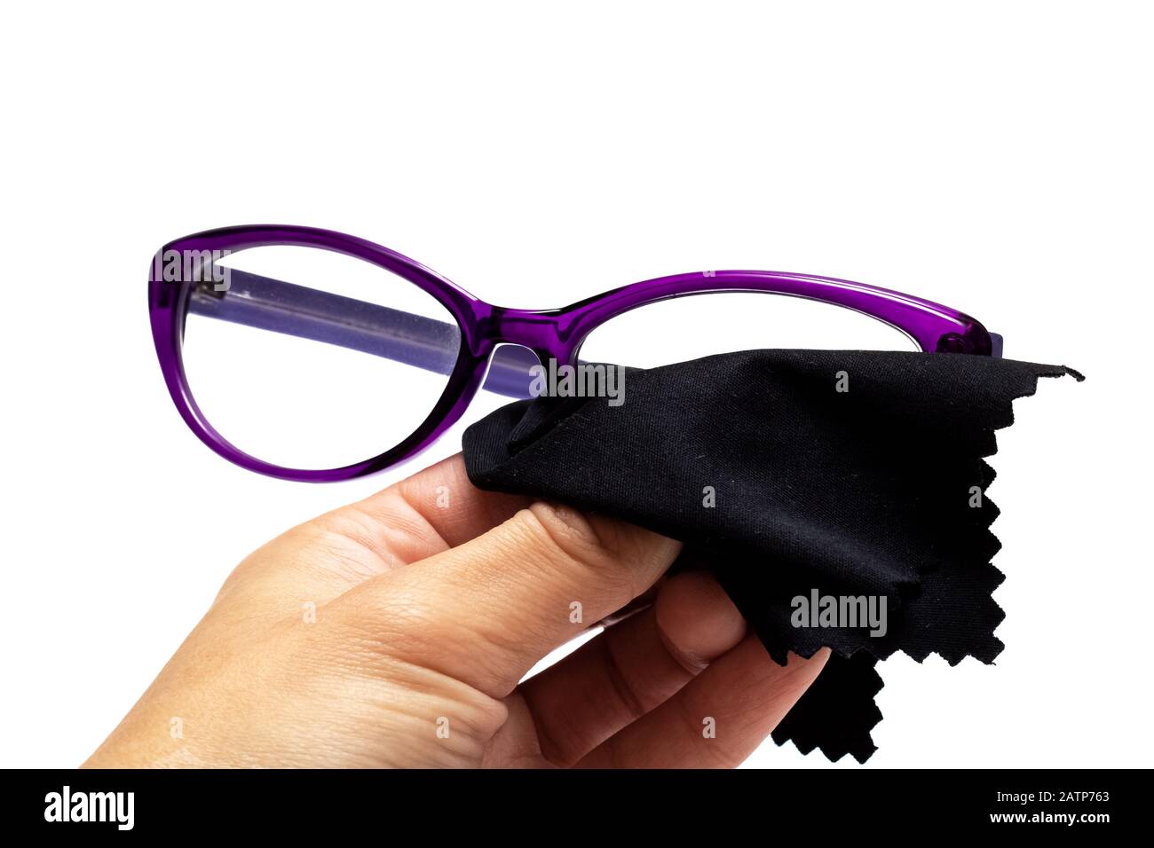 Wipes glasses with a black napkin isolated on white Stock Photo Alamy