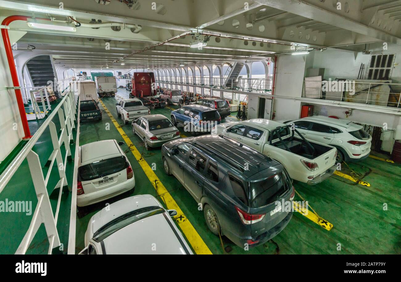 Cars parked on deck of Naviera Austral Quelat ferry, en route in Aysen Region, Patagonia, Chile Stock Photo