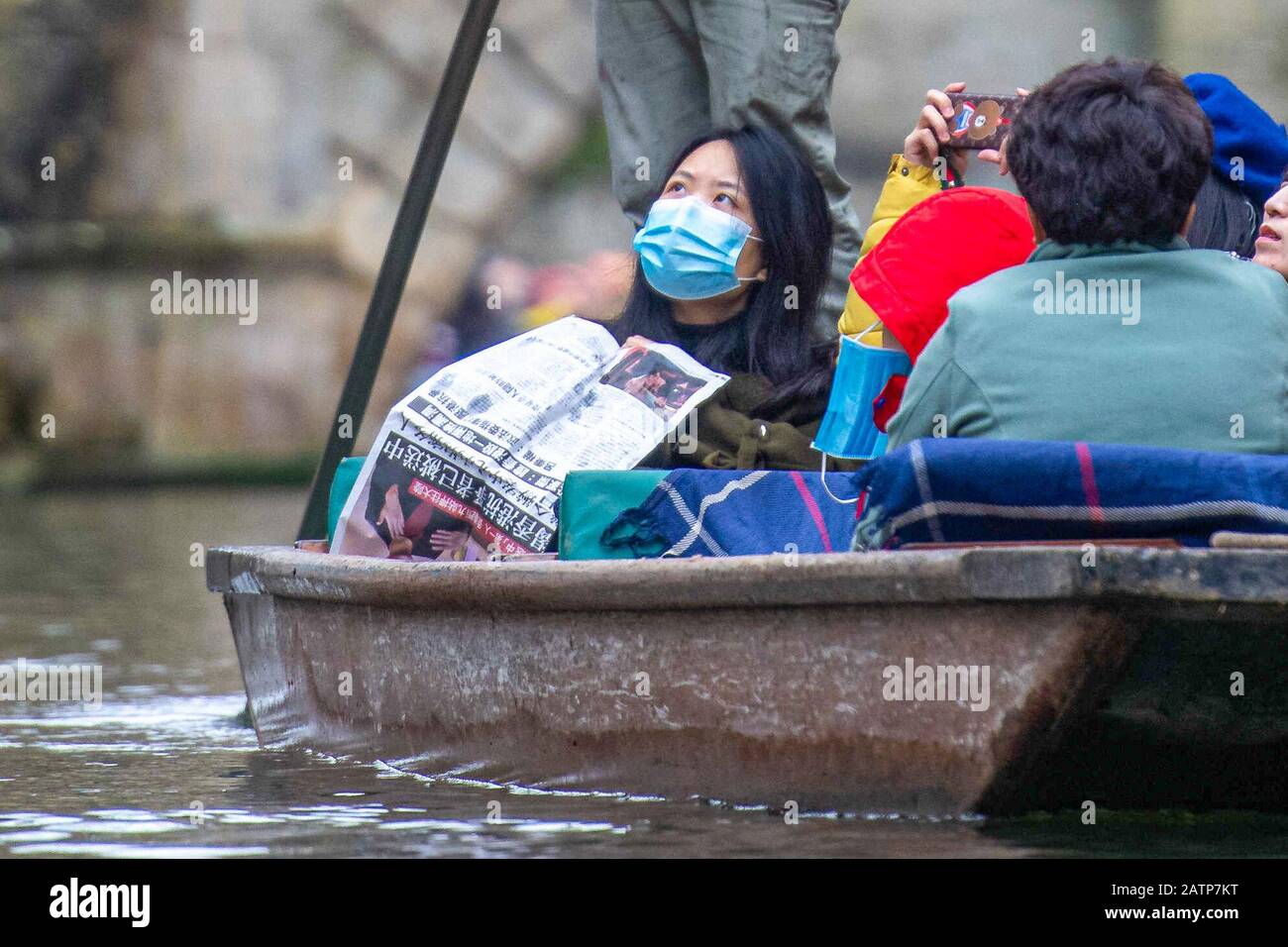 Picture dated January 25th shows tourists in Cambridge wearing face masks  whilst out punting on the River Cam at the weekend after the recent  outbreak of the highly contagious coronavirus Stock Photo -