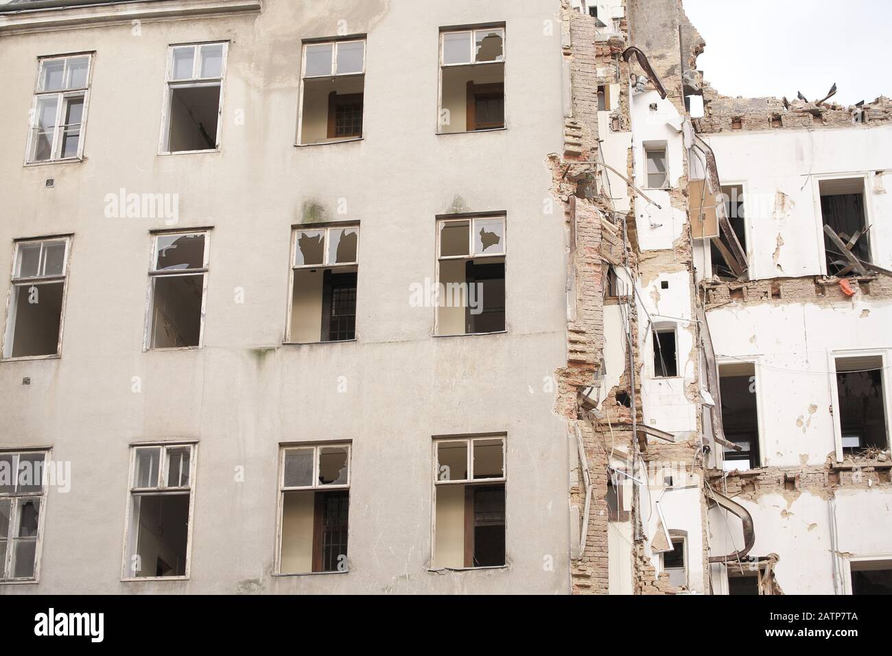 Demolished multistory building with sky, low-angle shot. demolition ...