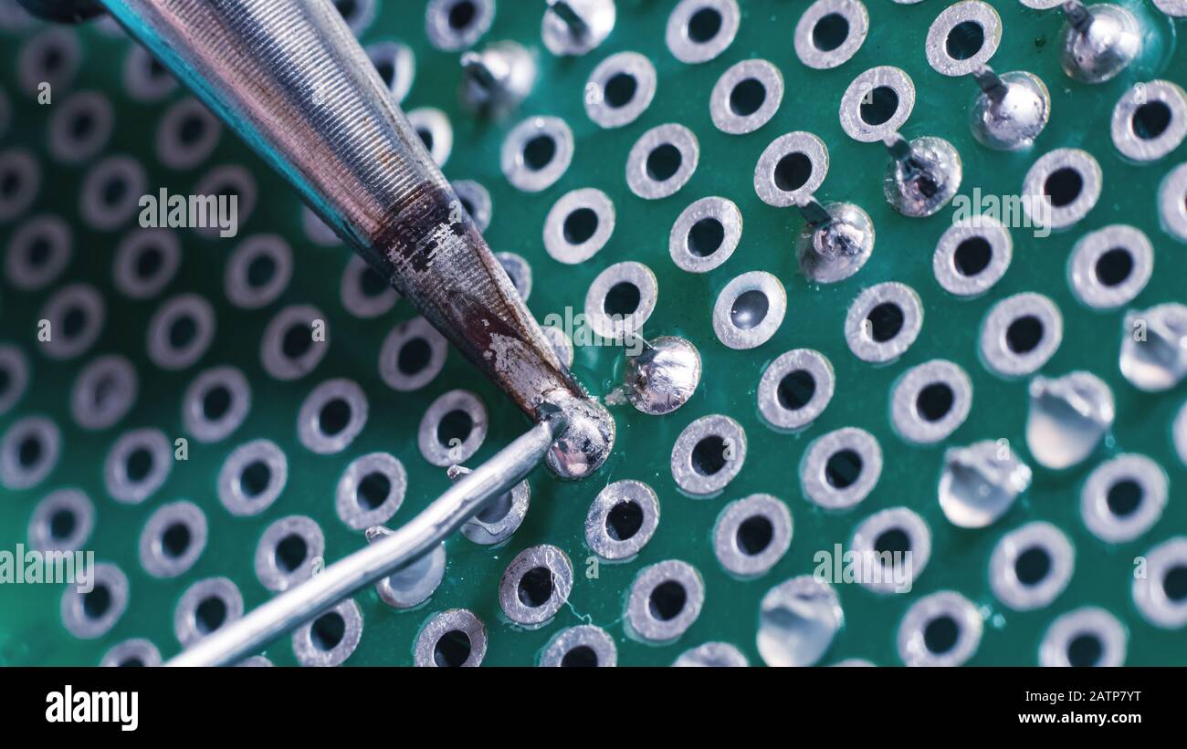 Soldering process, hot soldering iron and breadboard Stock Photo Alamy
