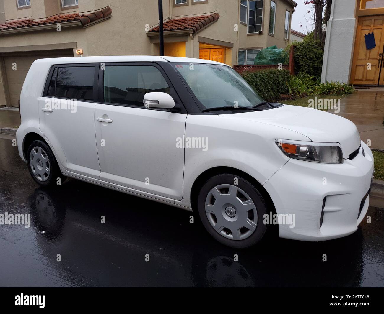 Side view of white Toyota Scion automobile in San Ramon, California, January 22, 2020. The Scion was discontinued by Toyota in 2016. () Stock Photo