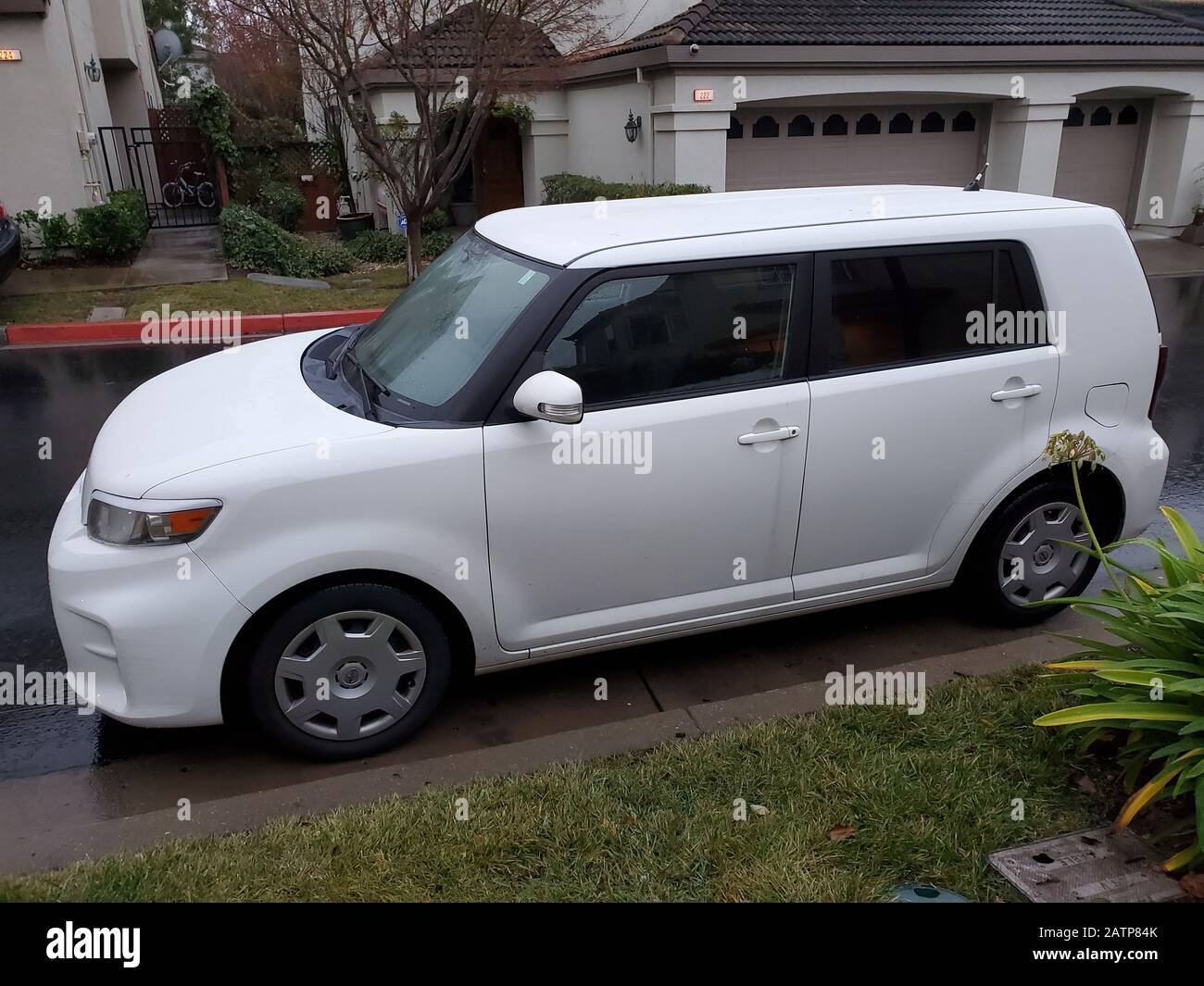 Side view of white Toyota Scion automobile in San Ramon, California, January 22, 2020. The Scion was discontinued by Toyota in 2016. () Stock Photo