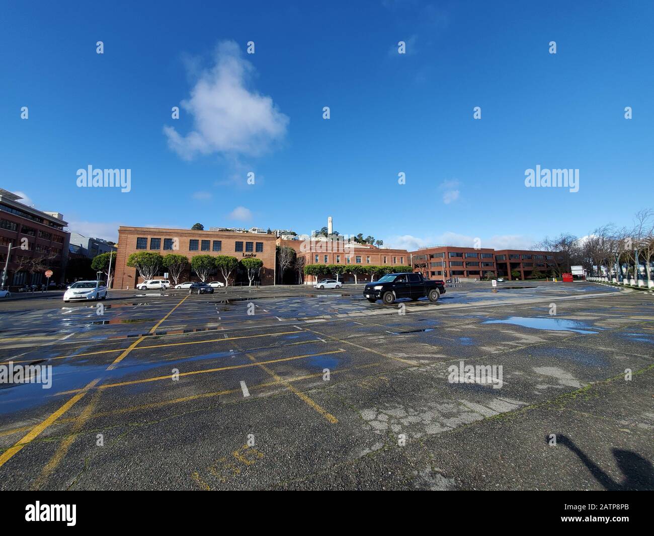 Wide angle of parking lots and businesses in the Embarcadero neighborhood of San Francisco, California, January 26, 2020. () Stock Photo