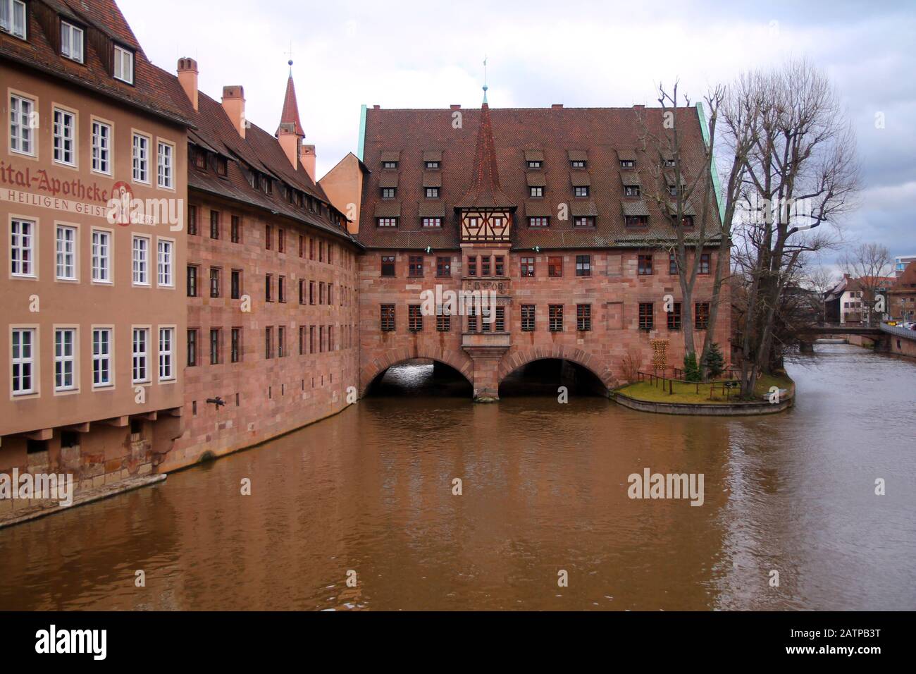 Red bricks medieval building in Nurnberg in Germany with water channel in winter Stock Photo