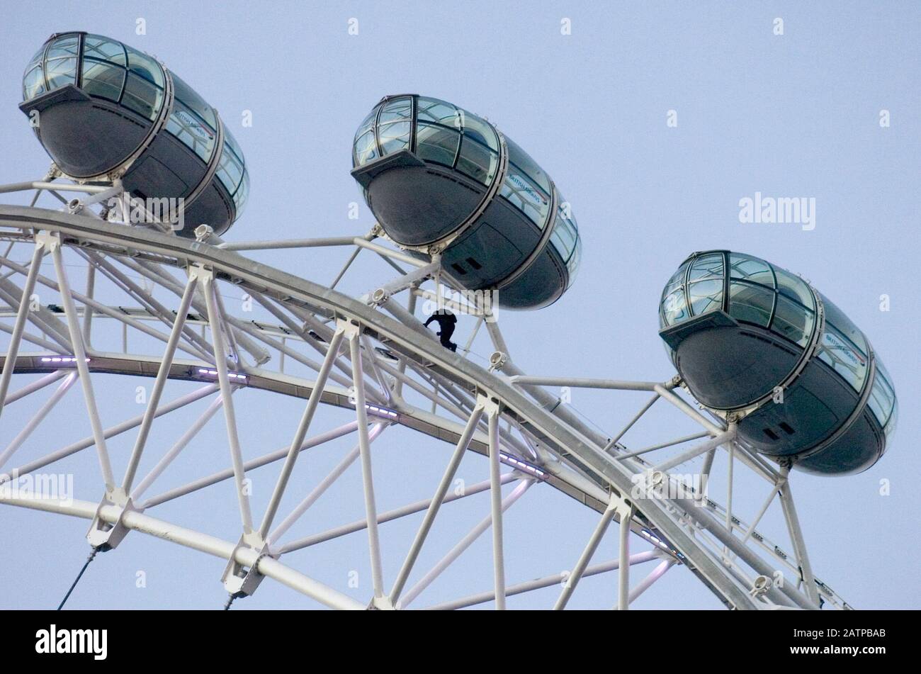 A base jumper leaping from the top of the London Eye at dawn in London 2006. Stock Photo