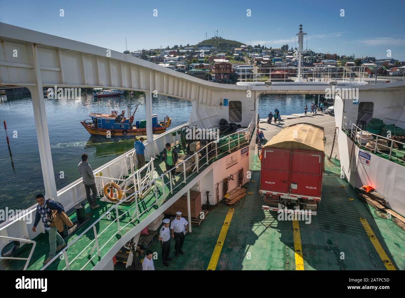 Truck backing up to enter Quelat ferry, docked in port of Melinka at Isla Ascension, Guaitecas Archipelago, Aysen Region, Patagonia, Chile Stock Photo