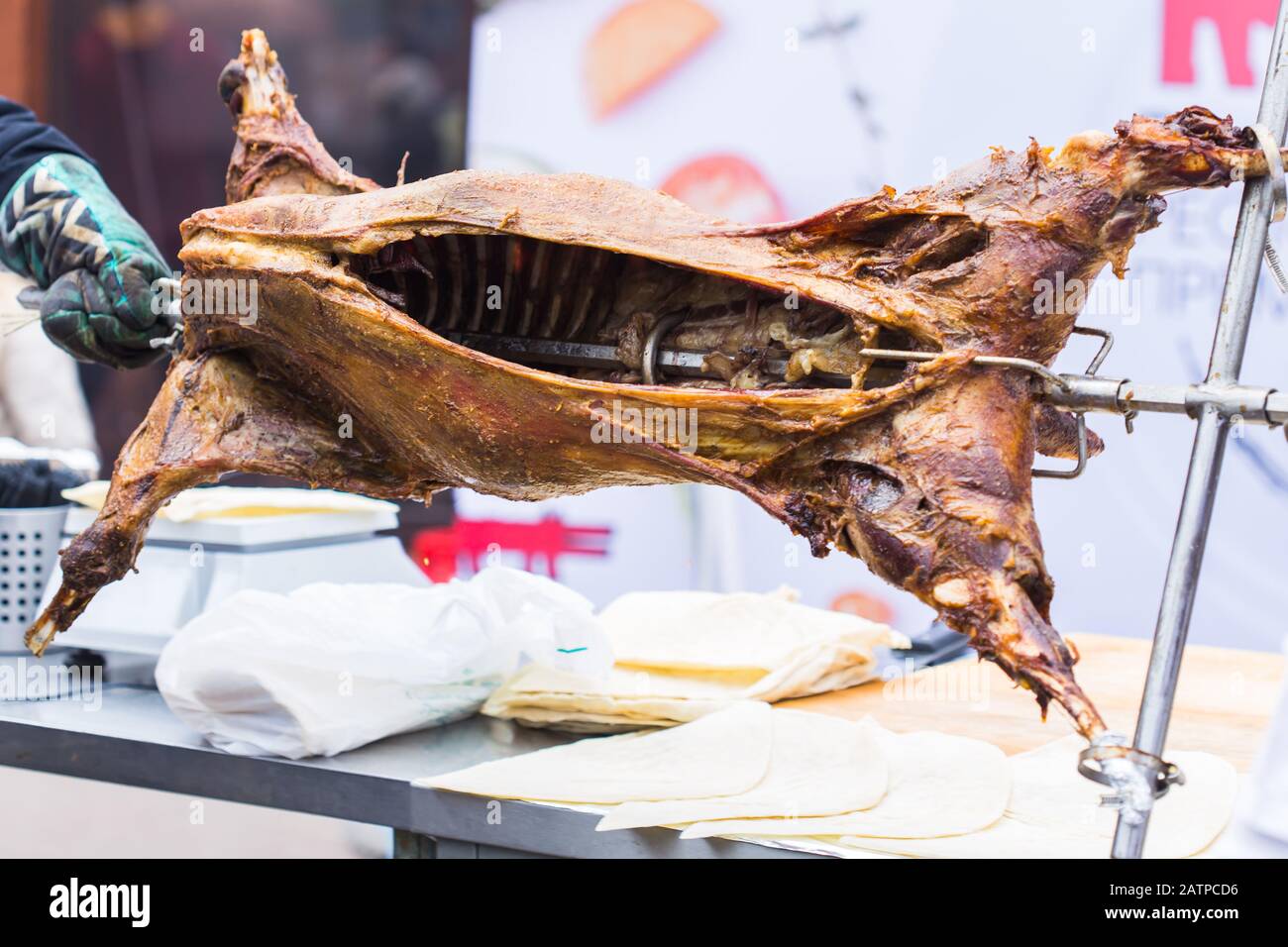 Whole lamb baked on a spit.The carcass of a lamb is roasted on a