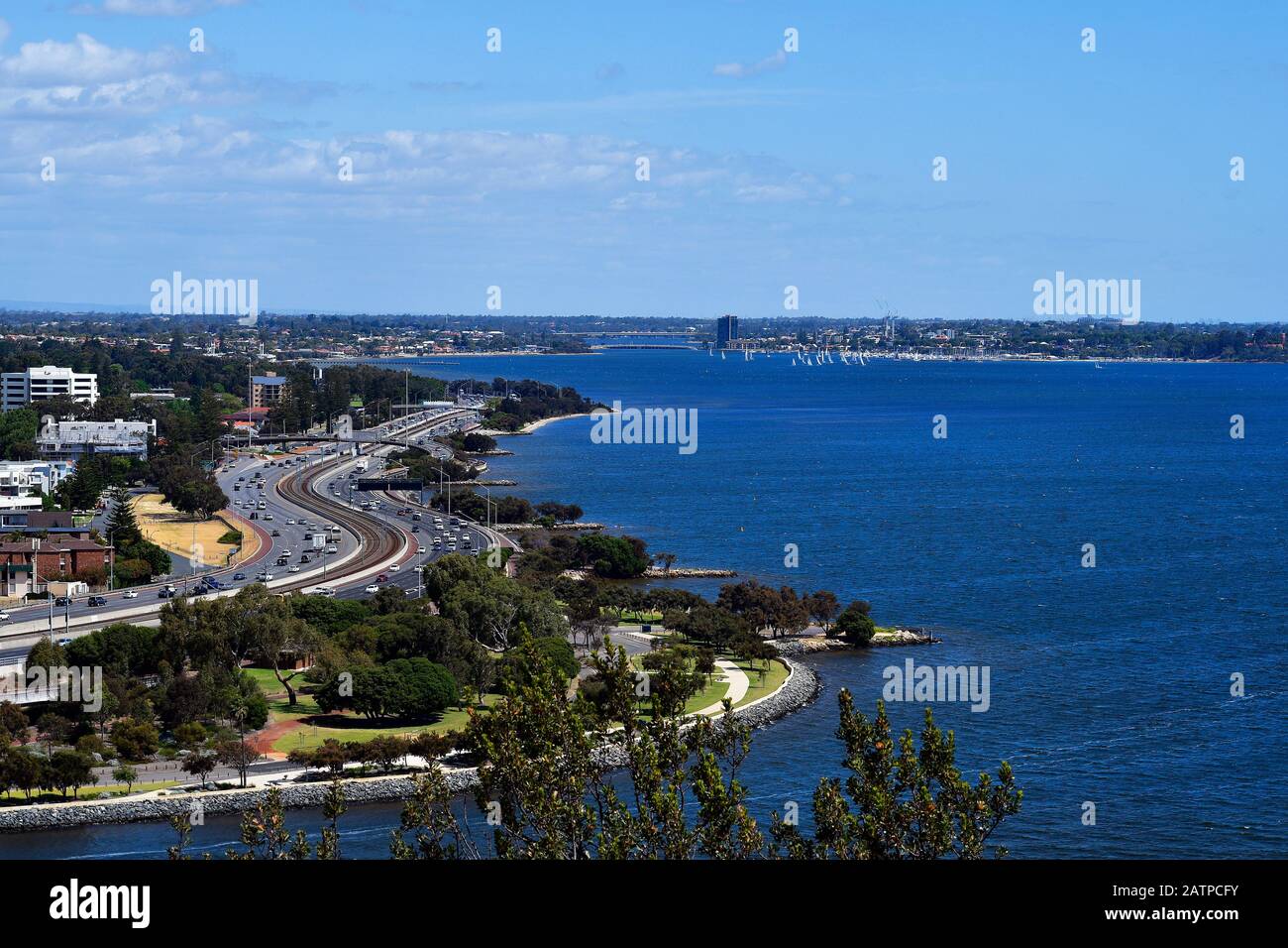 Australia, Perth, Swan river and traffic on Kwinana Freeway road to