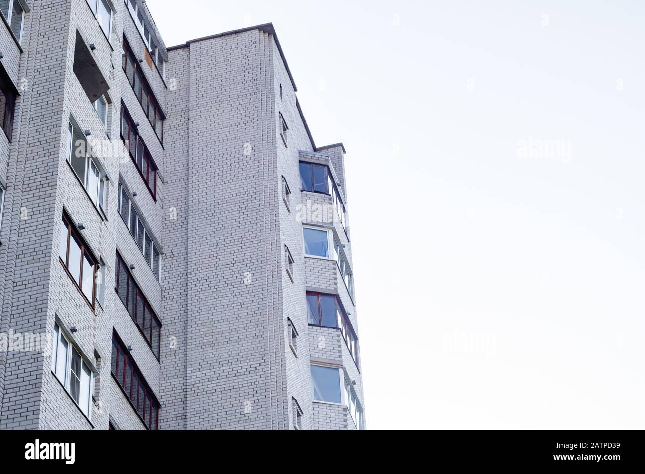 Windows of a tall house on a background of blue sky Stock Photo - Alamy