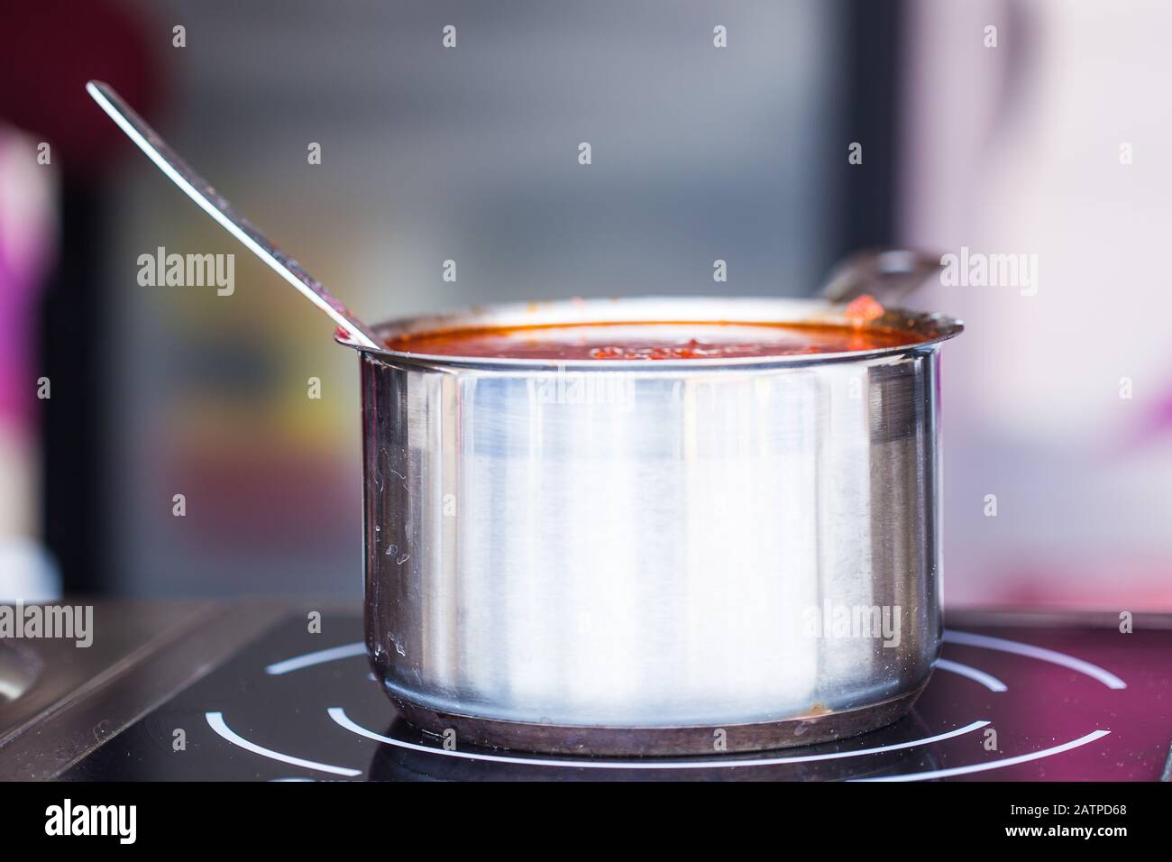 Tomato sauce in metal pan in the kitchen Stock Photo Alamy